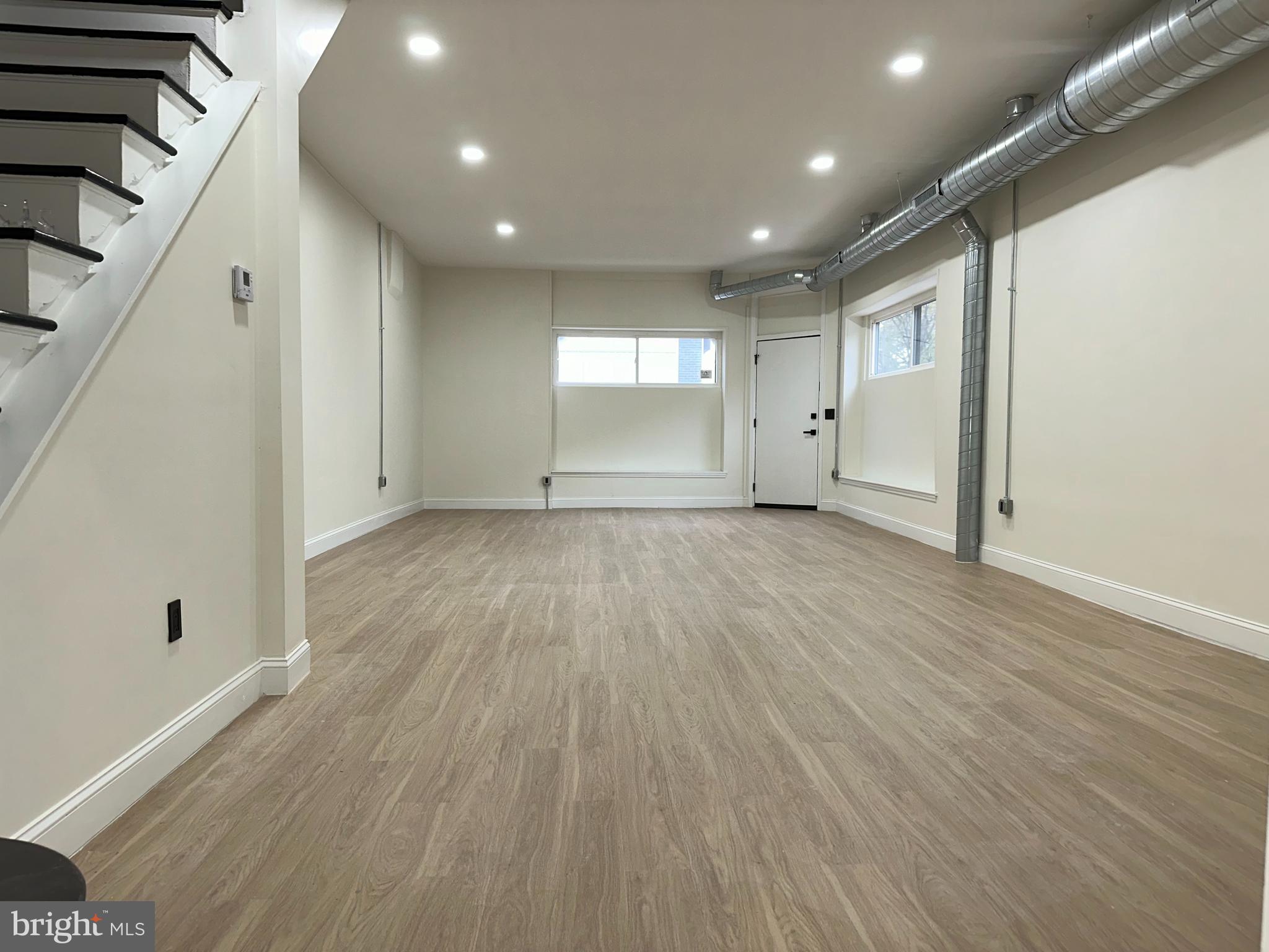 2000 Palethorp Street Philadelphia, PA 19122 - Photo 38 of 38 a view of an empty room with wooden floor and a window