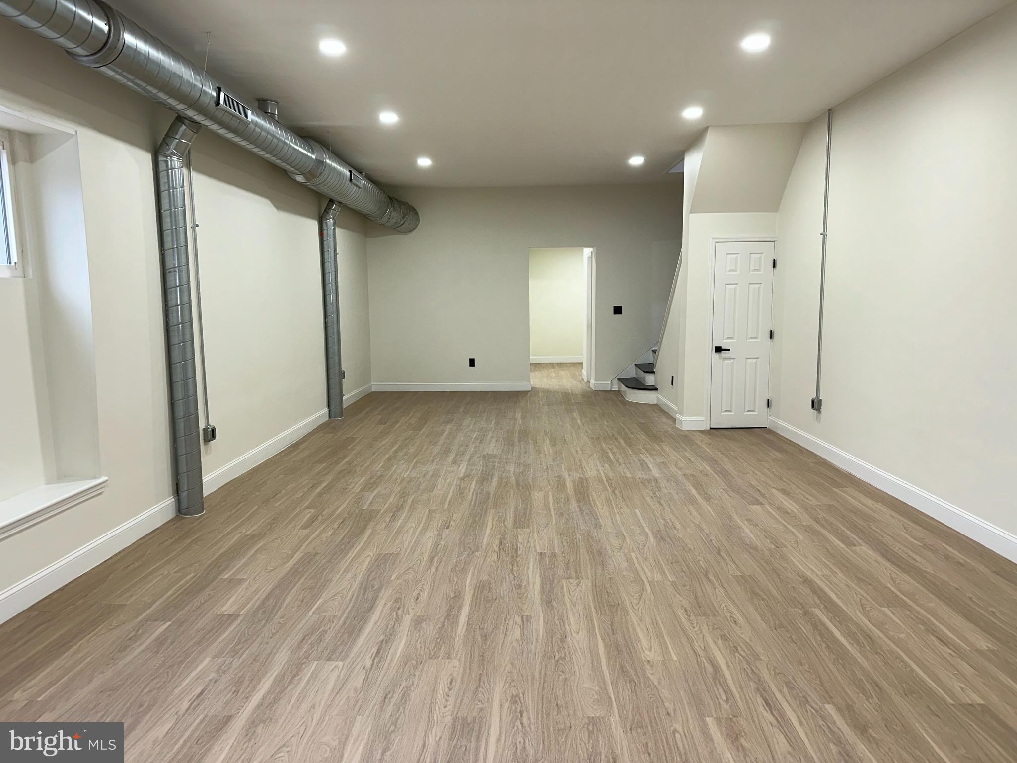 2000 Palethorp Street Philadelphia, PA 19122 - Photo 5 of 38 an empty room with wooden floor and windows