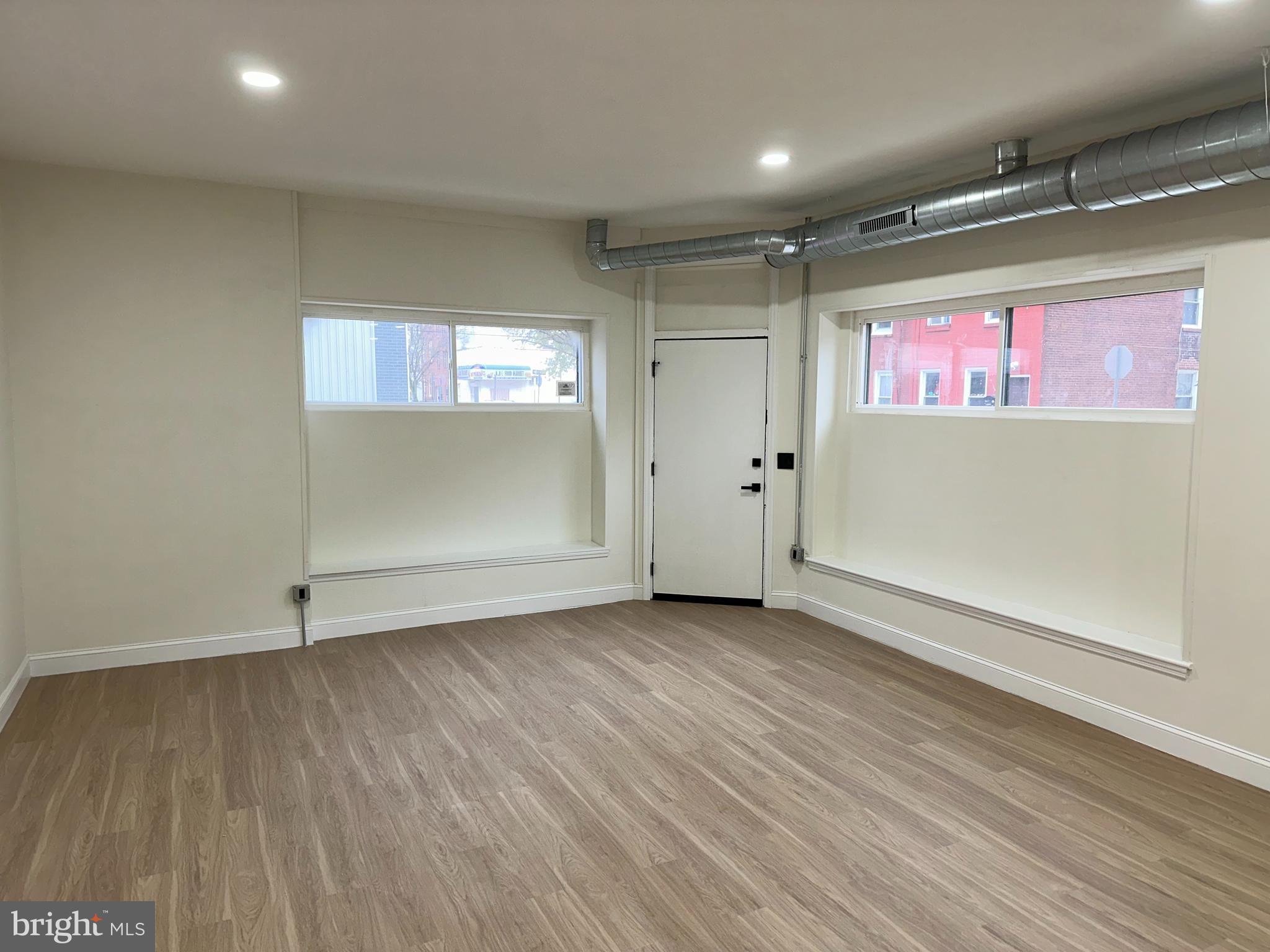 2000 Palethorp Street Philadelphia, PA 19122 - Photo 6 of 38 an empty room with wooden floor and windows