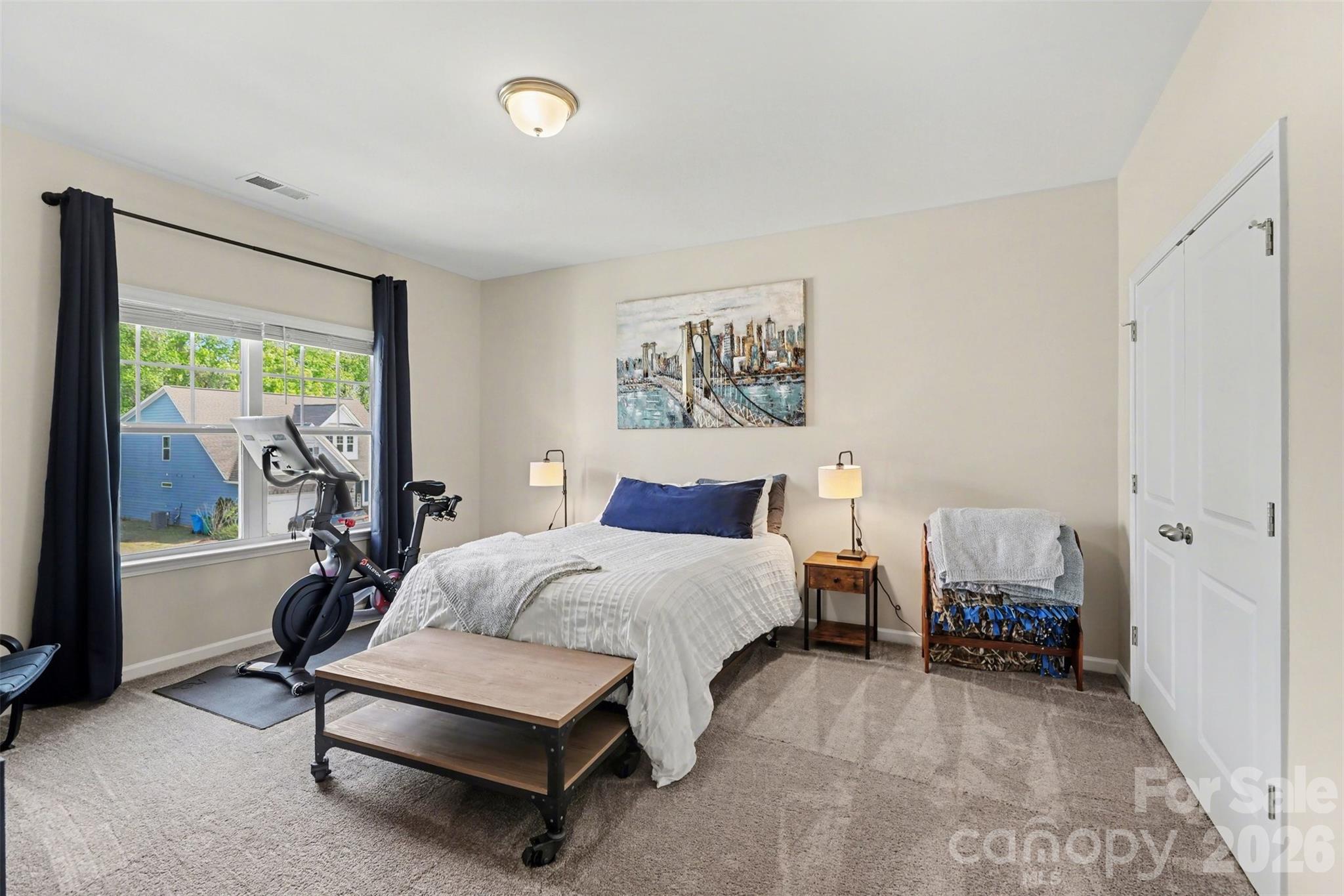 248 Kerri Dawn Lane Locust, NC 28097 - Photo 20 of 25 a spacious bedroom with a bed and a large window