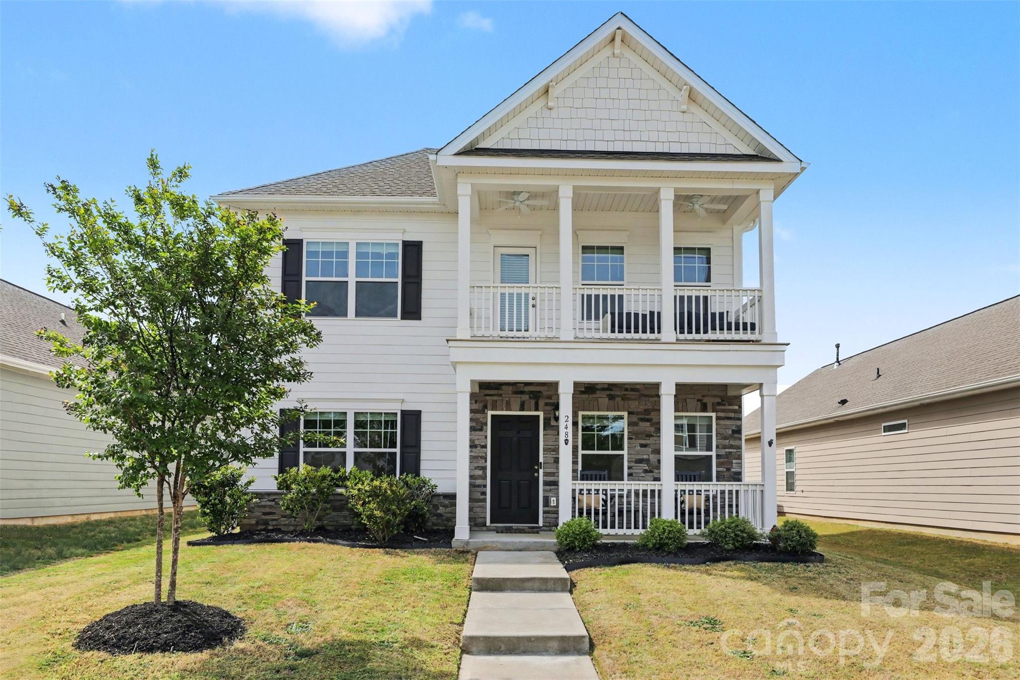 248 Kerri Dawn Lane Locust, NC 28097 - Photo 2 of 25 a front view of a house with a garden