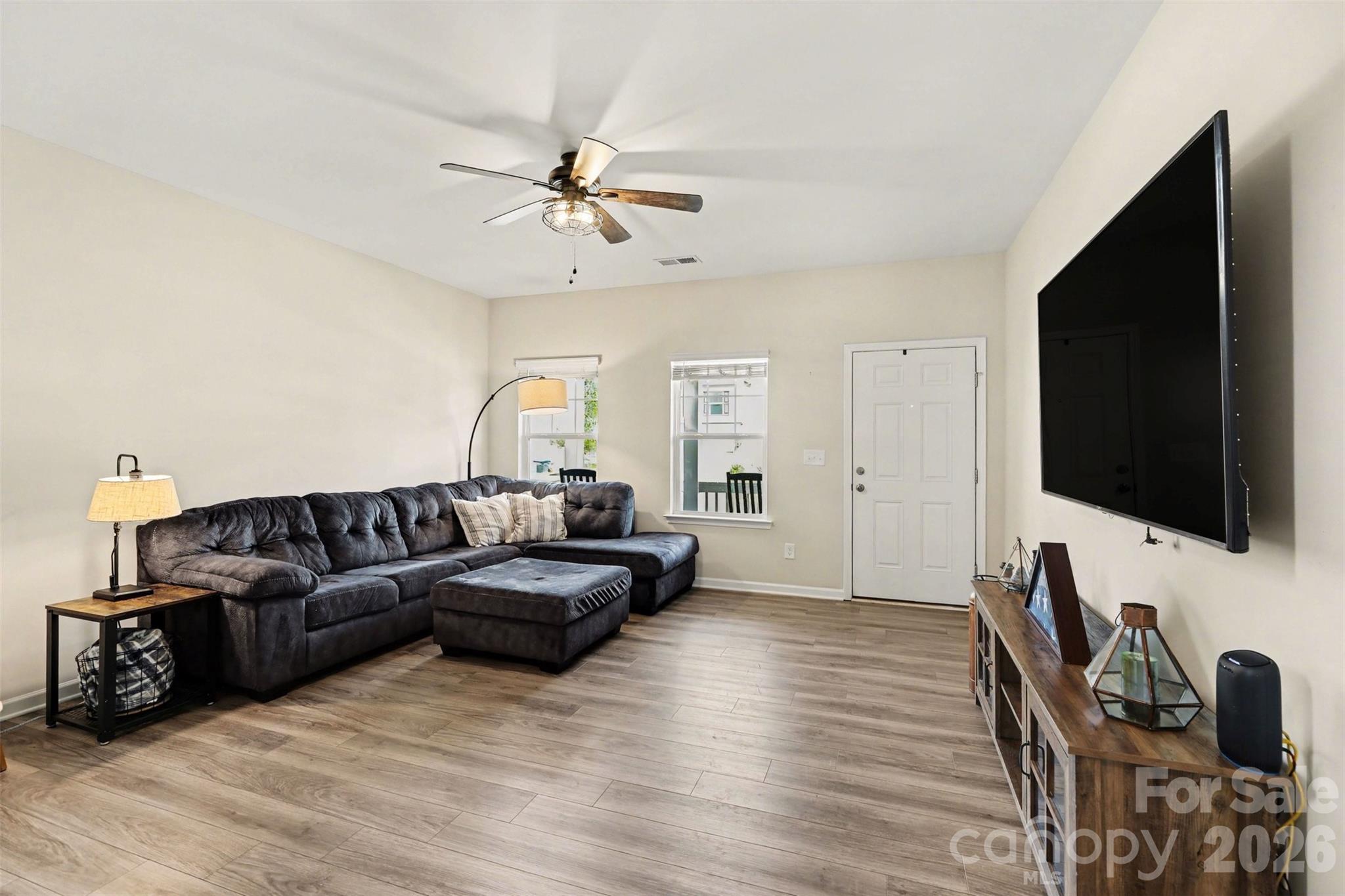 248 Kerri Dawn Lane Locust, NC 28097 - Photo 4 of 25 a living room with furniture and a flat screen tv