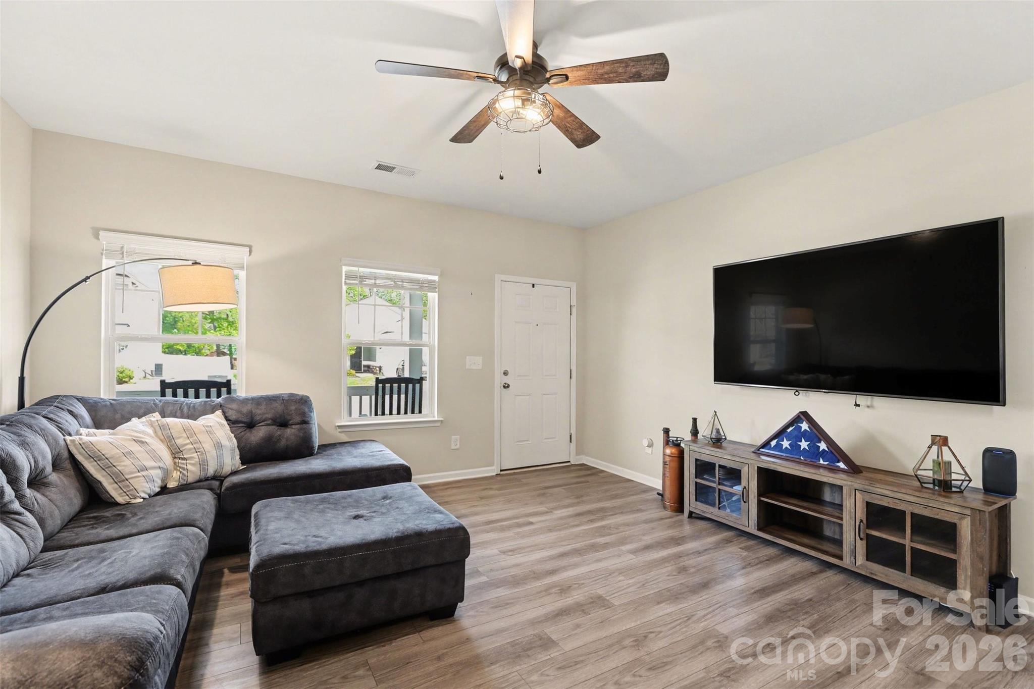 248 Kerri Dawn Lane Locust, NC 28097 - Photo 5 of 25 a living room with furniture and a flat screen tv