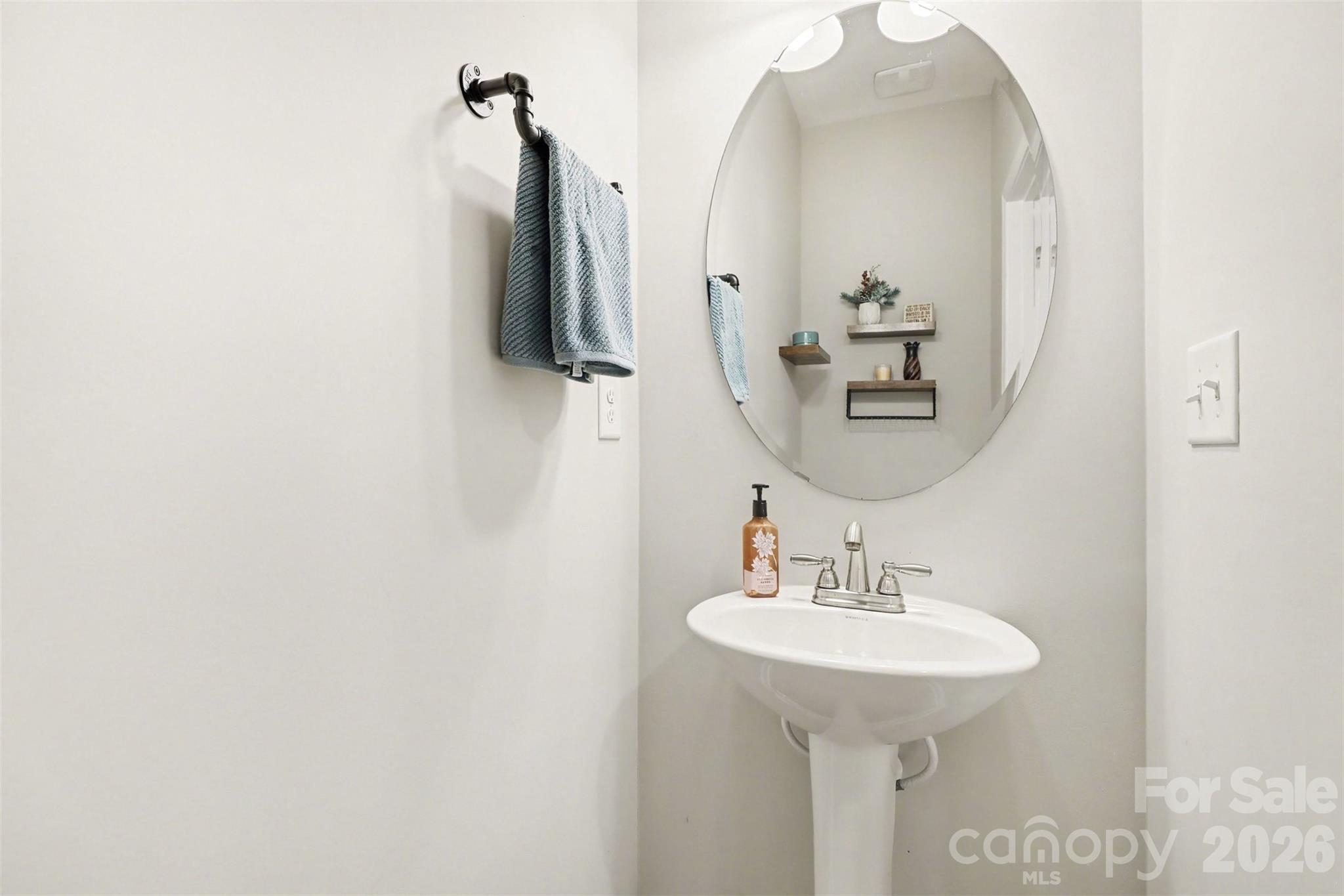 248 Kerri Dawn Lane Locust, NC 28097 - Photo 7 of 25 a bathroom with a sink and mirror