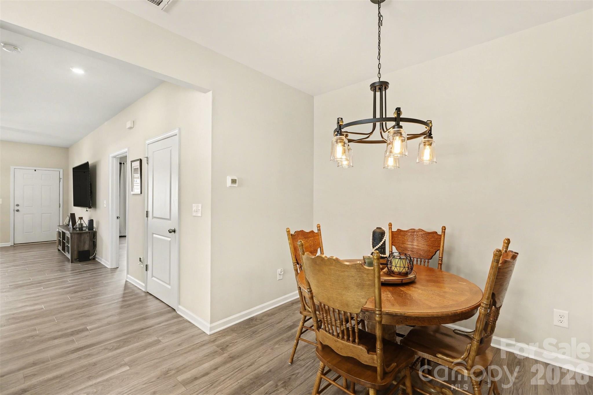 248 Kerri Dawn Lane Locust, NC 28097 - Photo 8 of 25 a view of a dining room with furniture and wooden floor