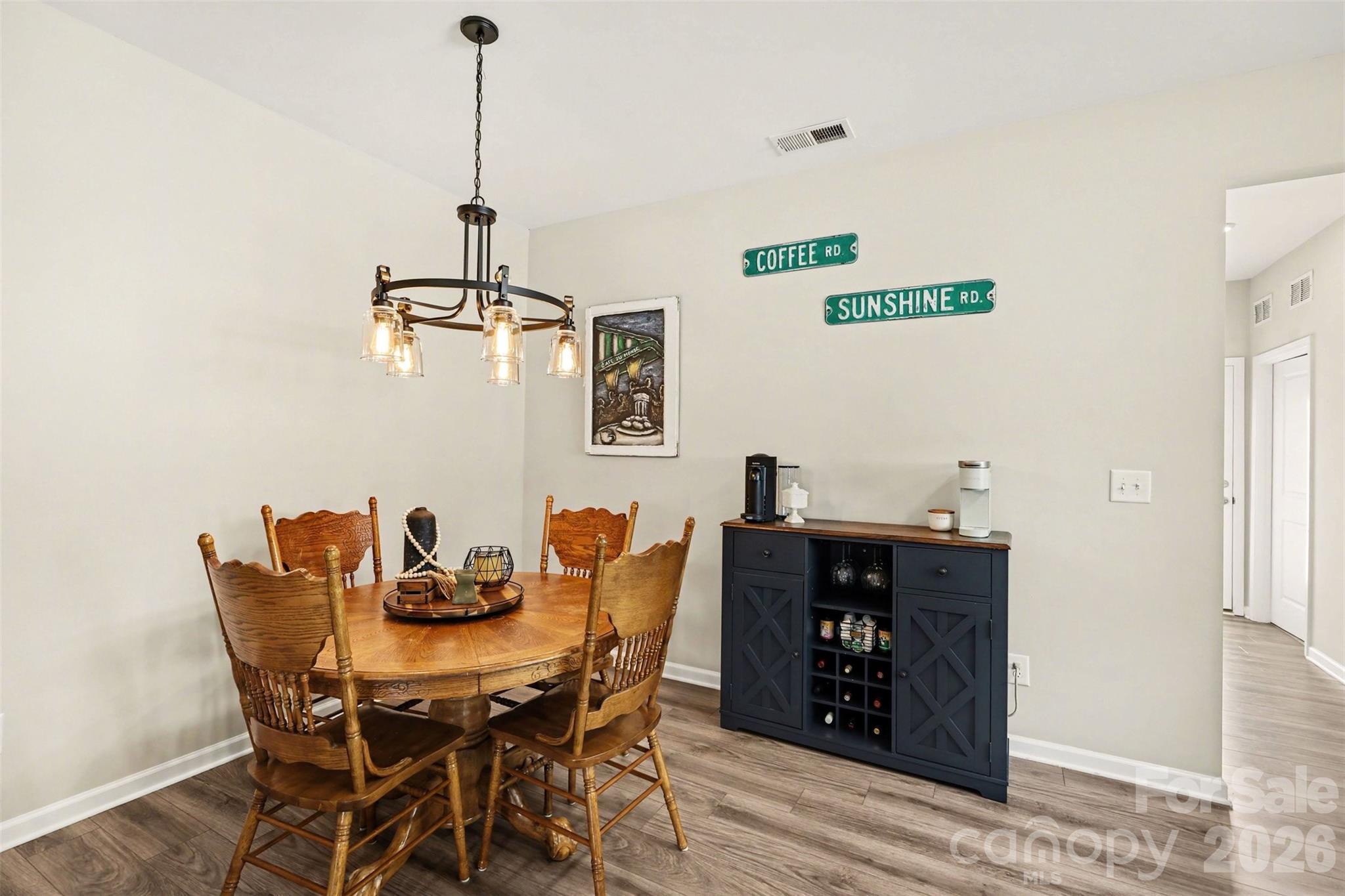 248 Kerri Dawn Lane Locust, NC 28097 - Photo 9 of 25 a dining room with furniture and wooden floor