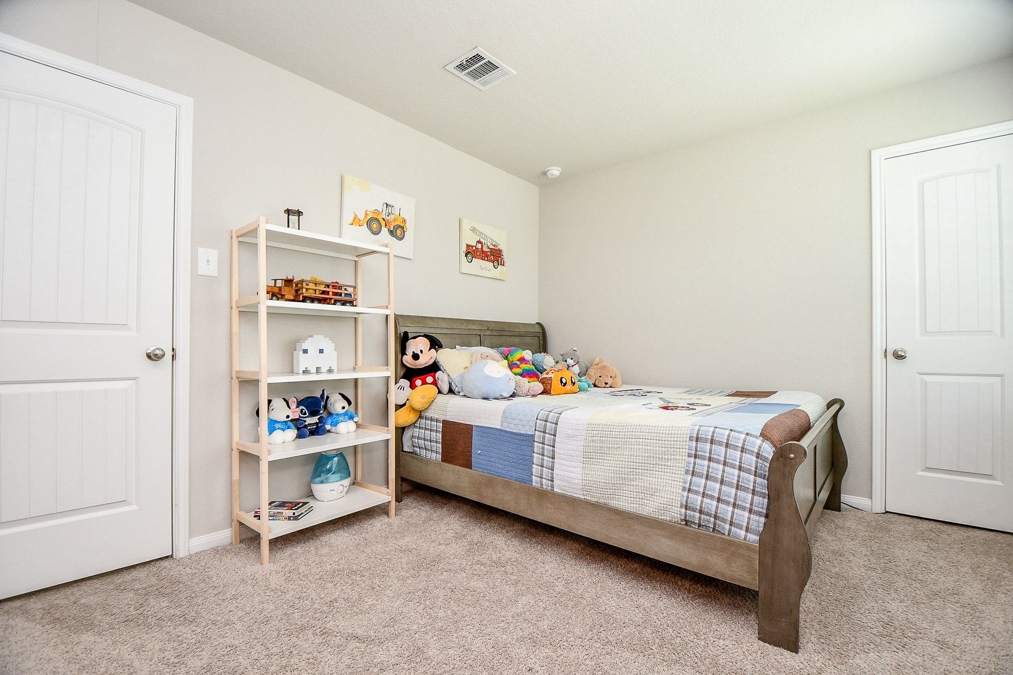 4834 Purple Wisteria Lane Spring, TX 77373 - Photo 20 of 31 Second bedroom located upstairs, featuring neutral tones and carpeting.