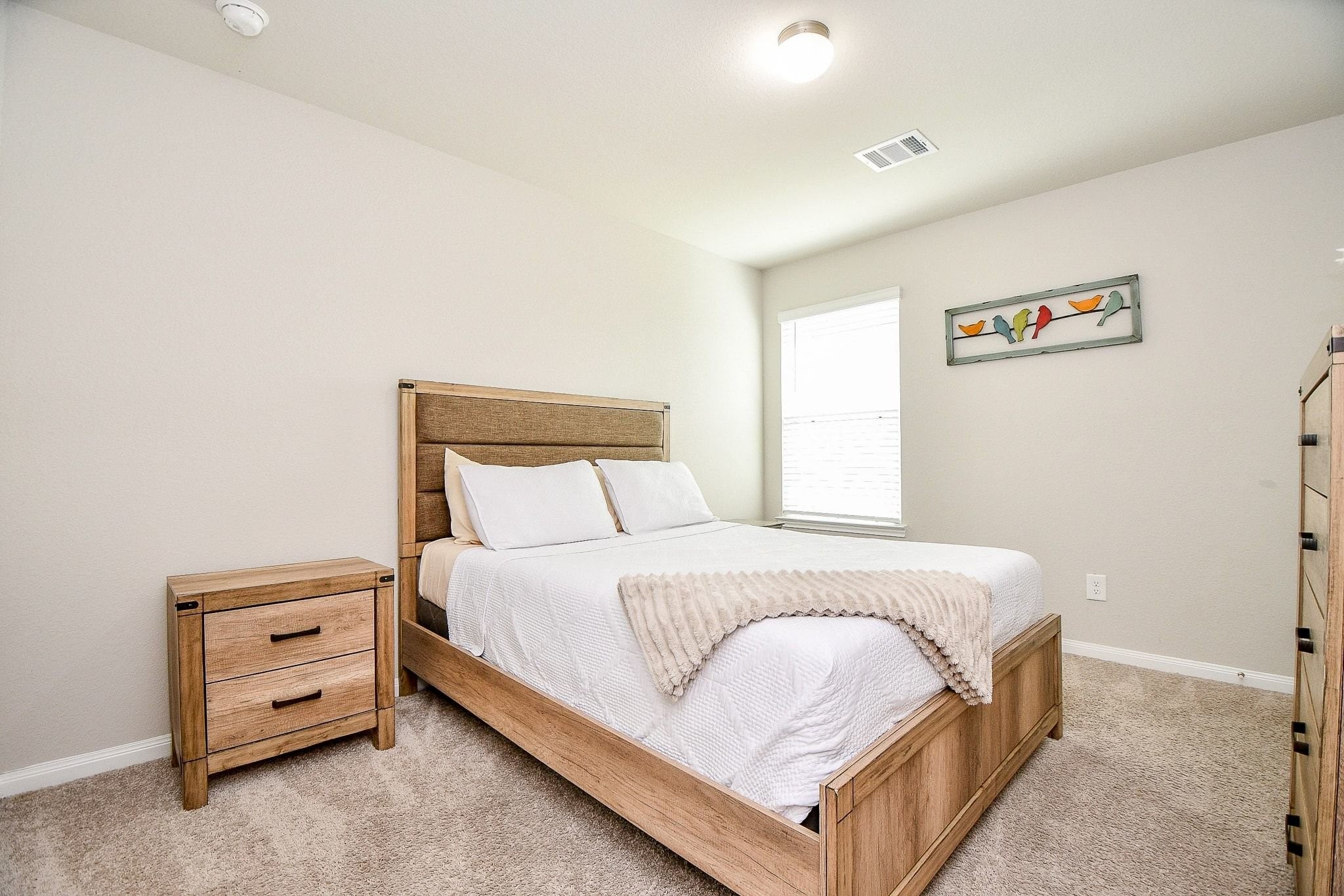 4834 Purple Wisteria Lane Spring, TX 77373 - Photo 22 of 31 Third bedroom located upstairs, featuring neutral tones and carpeting.