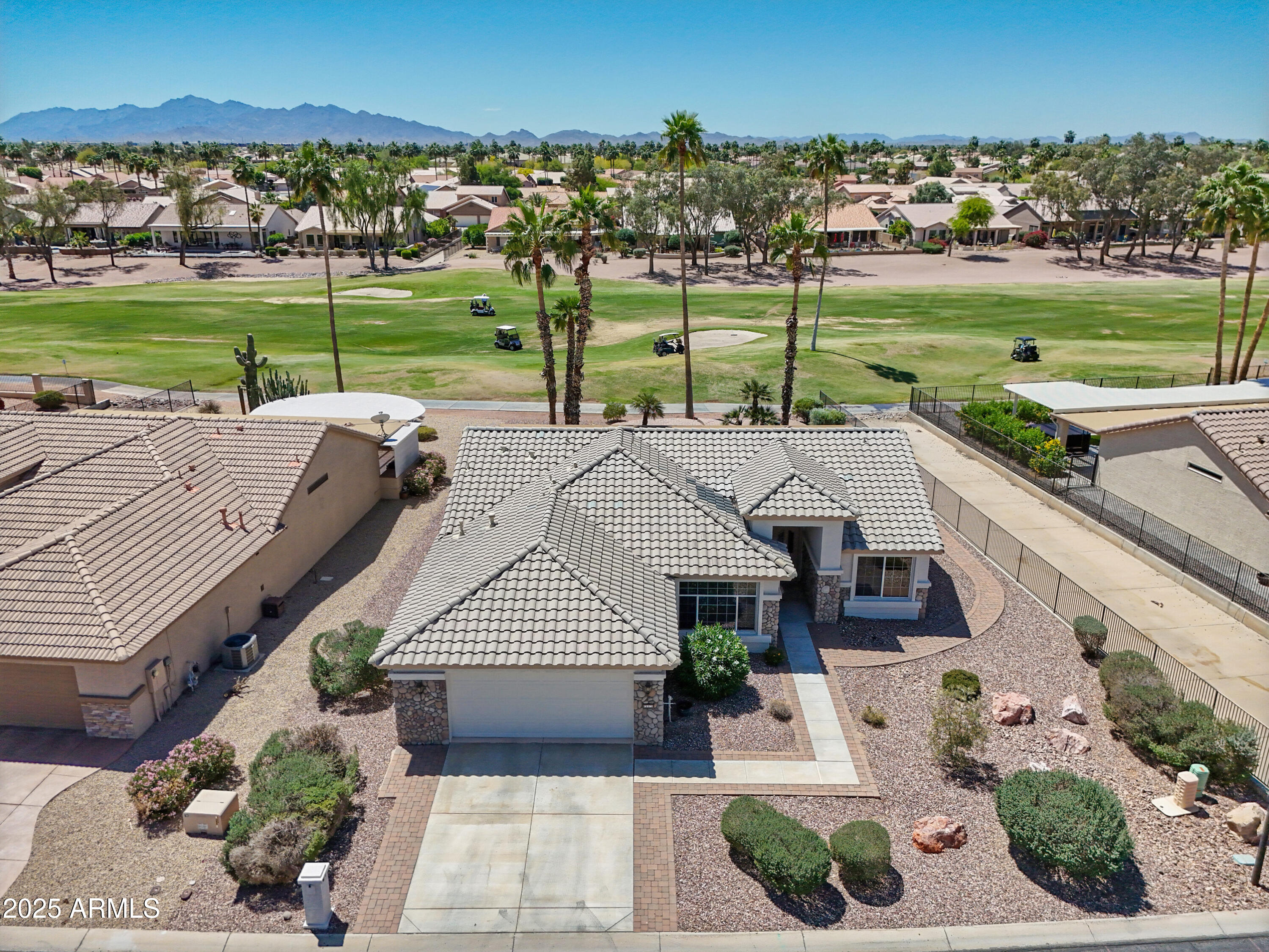 a view of a house with garden and a patio