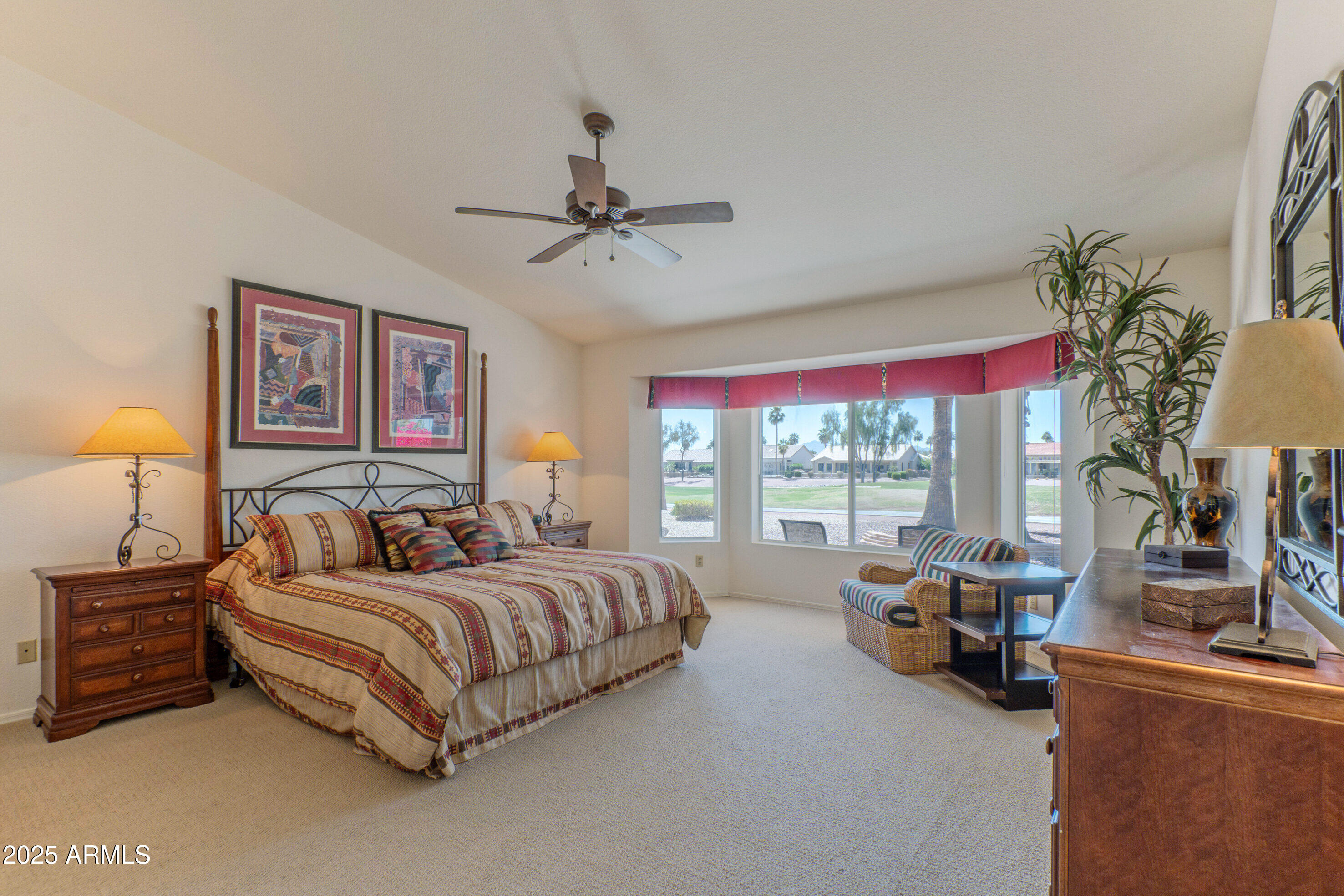 15371 Piccadilly Road Goodyear, AZ 85395 - Photo 13 of 26 a bedroom with a bed couch and window