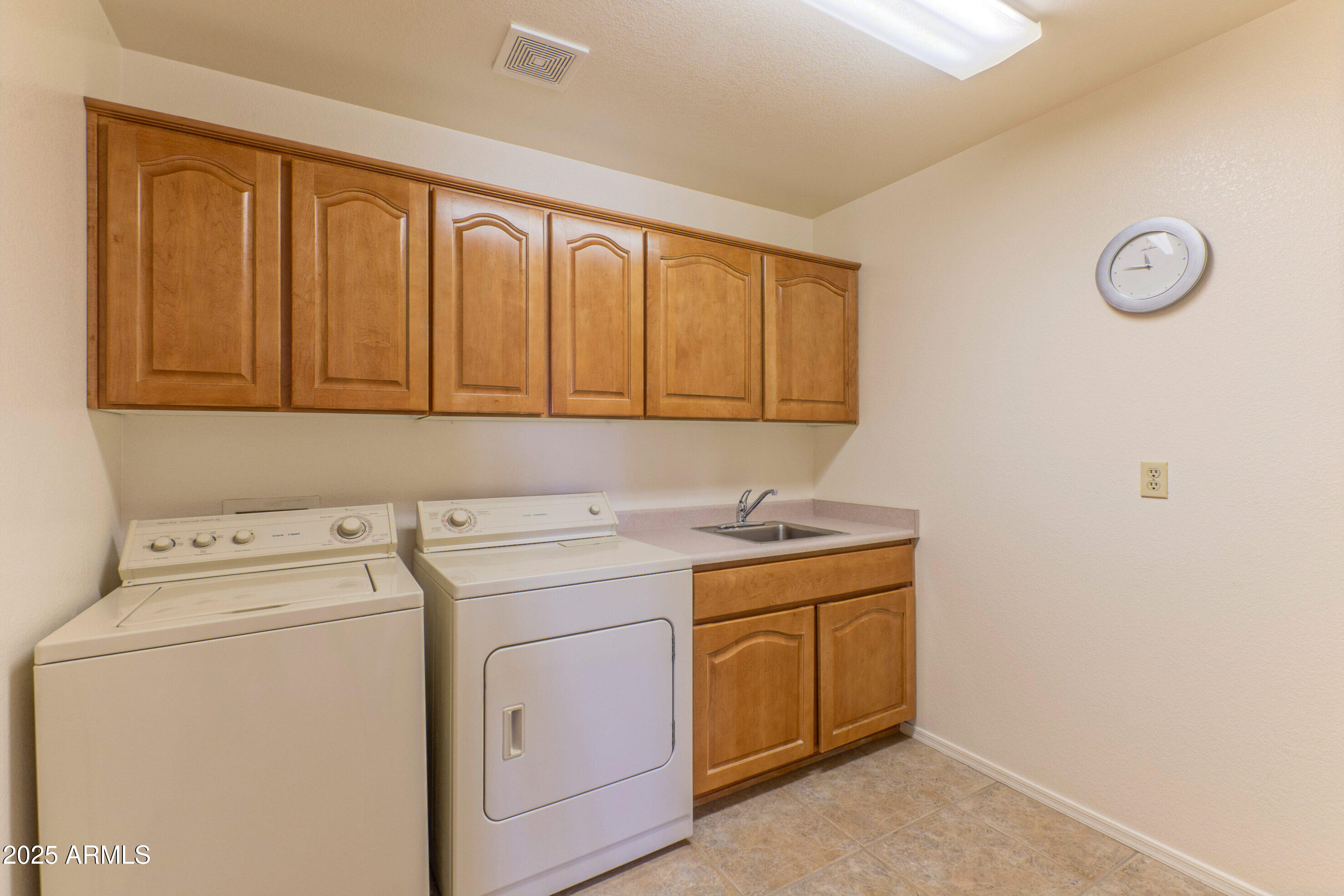 15371 Piccadilly Road Goodyear, AZ 85395 - Photo 17 of 26 a utility room with dryer and washer