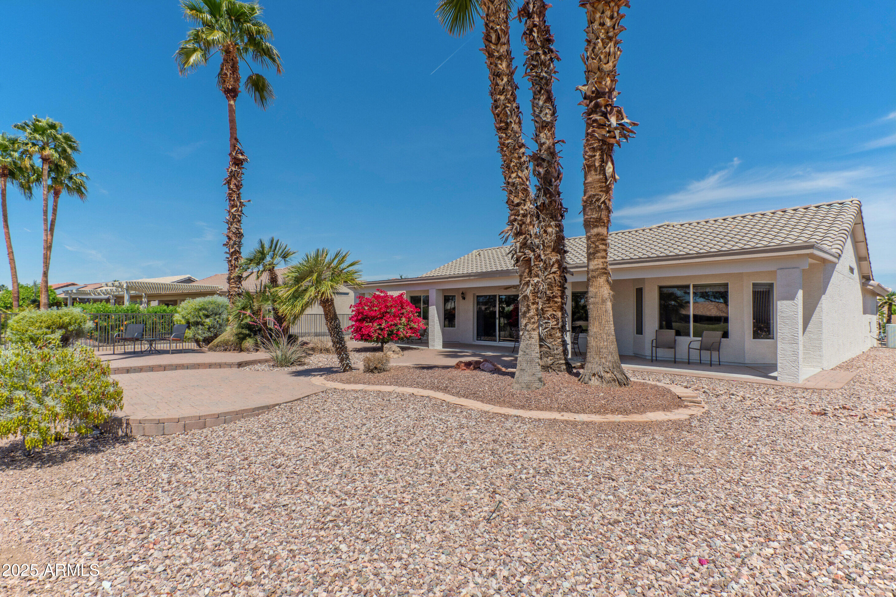15371 Piccadilly Road Goodyear, AZ 85395 - Photo 19 of 26 a front view of a house with garden