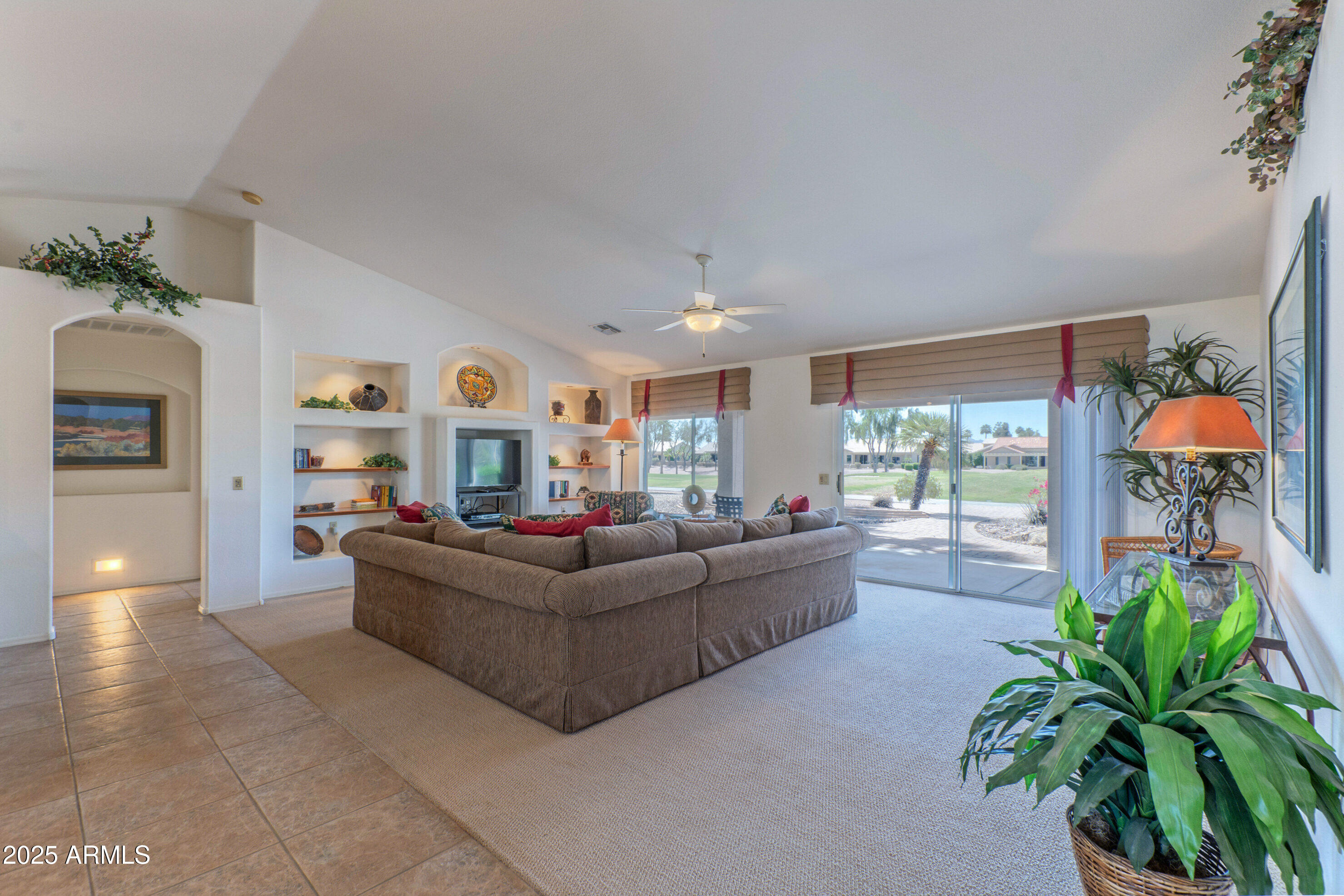 15371 Piccadilly Road Goodyear, AZ 85395 - Photo 6 of 26 a living room with furniture and a large window