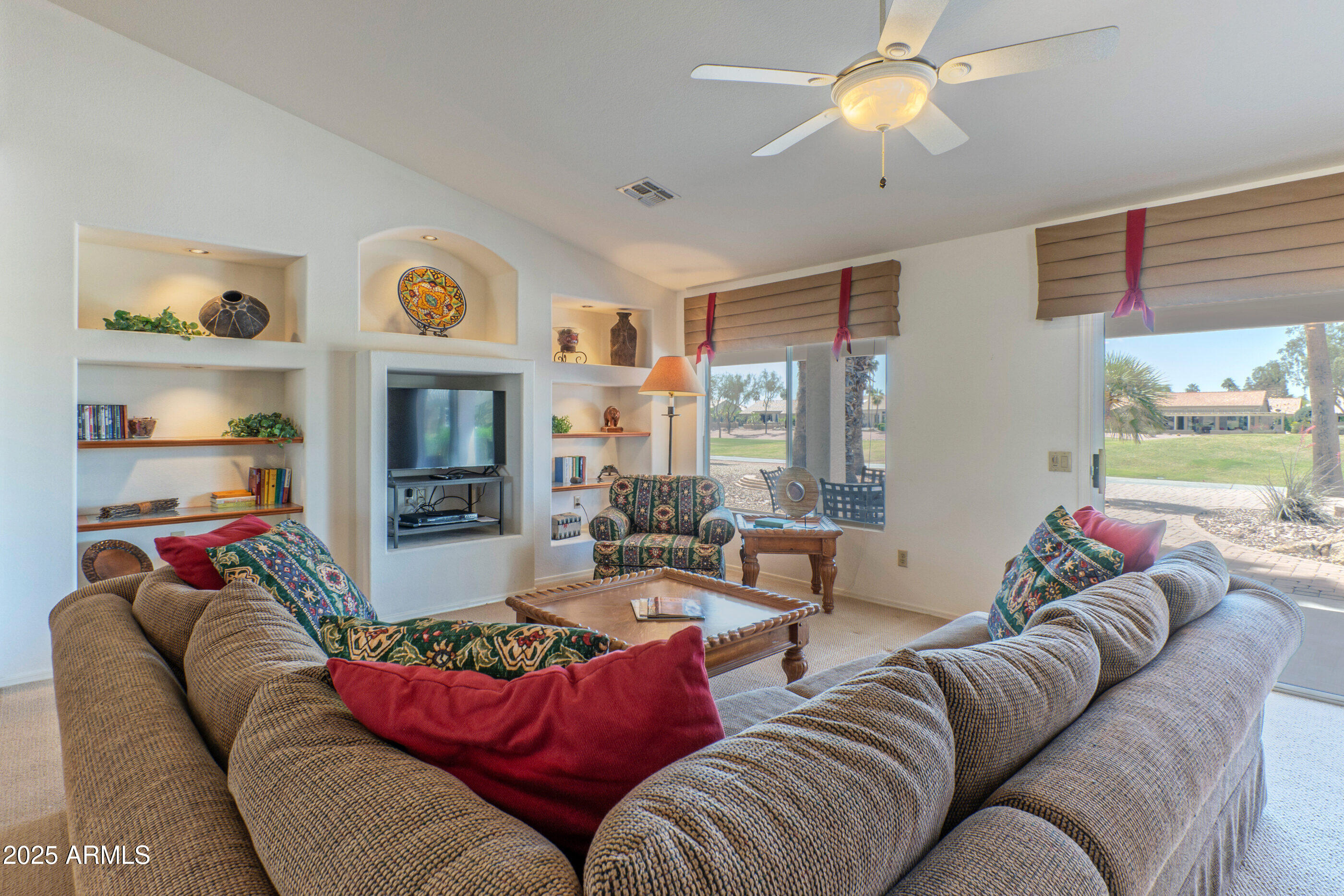 15371 Piccadilly Road Goodyear, AZ 85395 - Photo 7 of 26 a living room with furniture kitchen view and a window