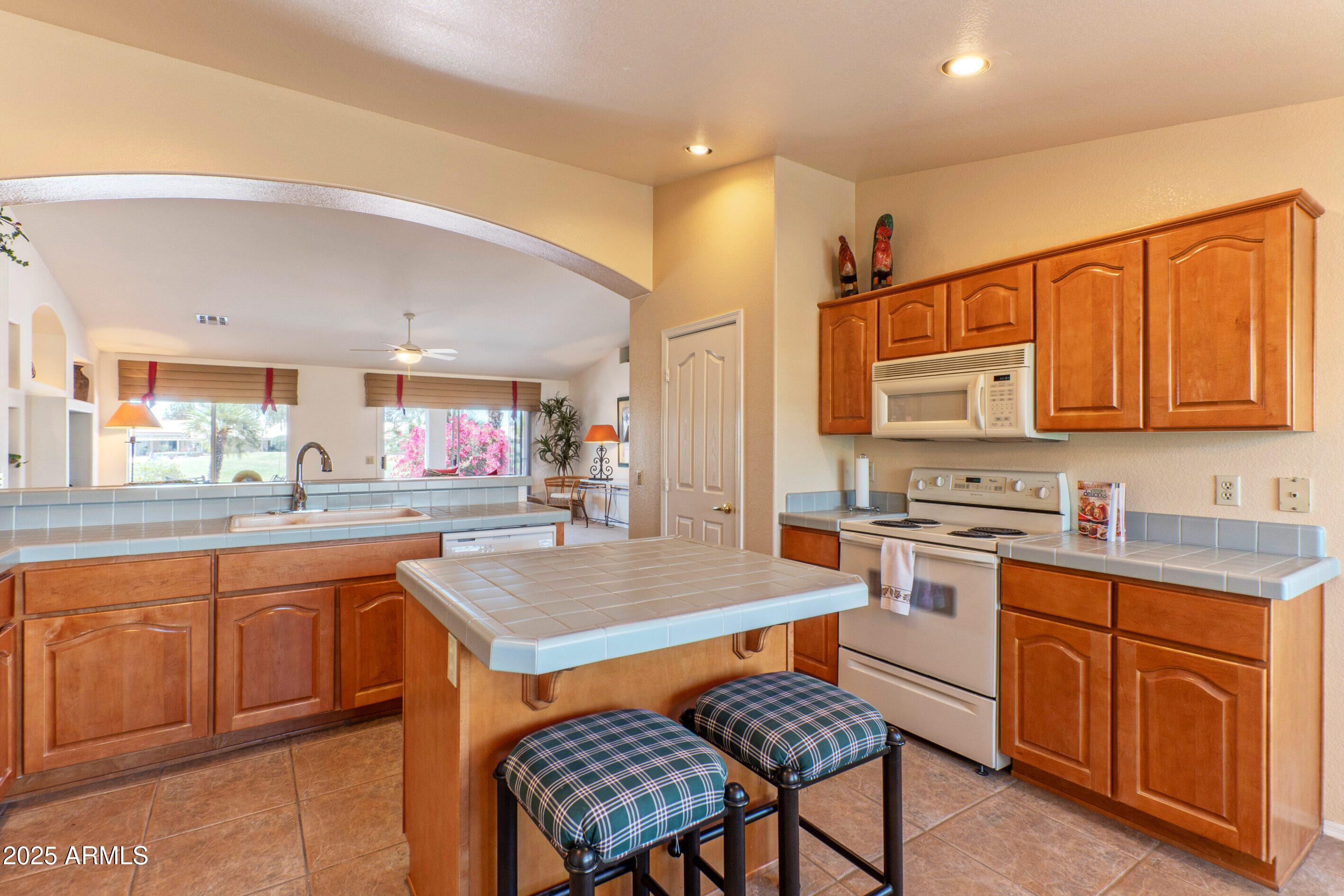 15371 Piccadilly Road Goodyear, AZ 85395 - Photo 9 of 26 a kitchen with a sink stove and cabinets