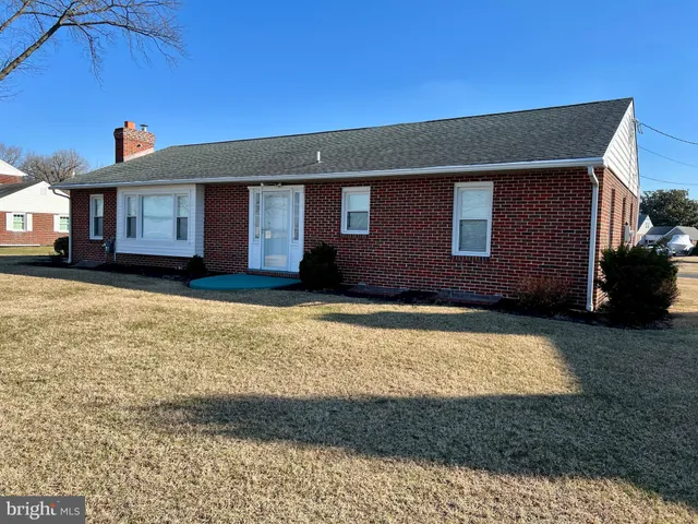 a house that has a big yard in front of it