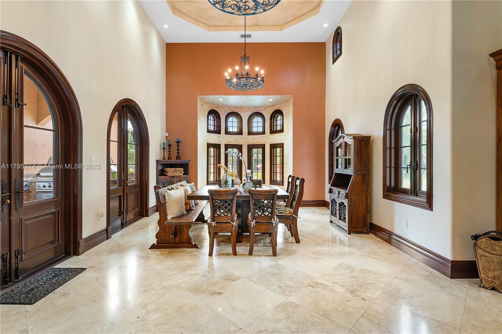 17201 Southwest 248th Street Homestead, FL 33031 - Photo 13 of 78 a view of a dining room with furniture and chandelier