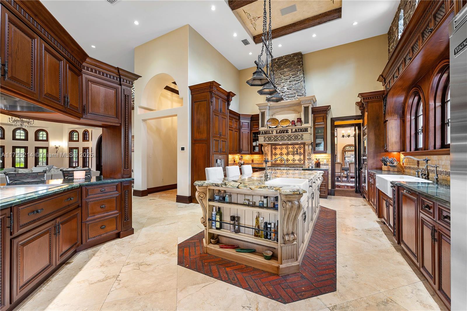 17201 Southwest 248th Street Homestead, FL 33031 - Photo 14 of 78 a large kitchen with stainless steel appliances granite countertop a stove and cabinets