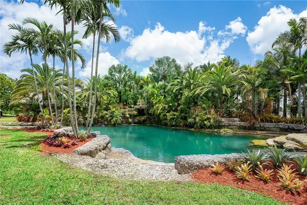 a lake view with a garden