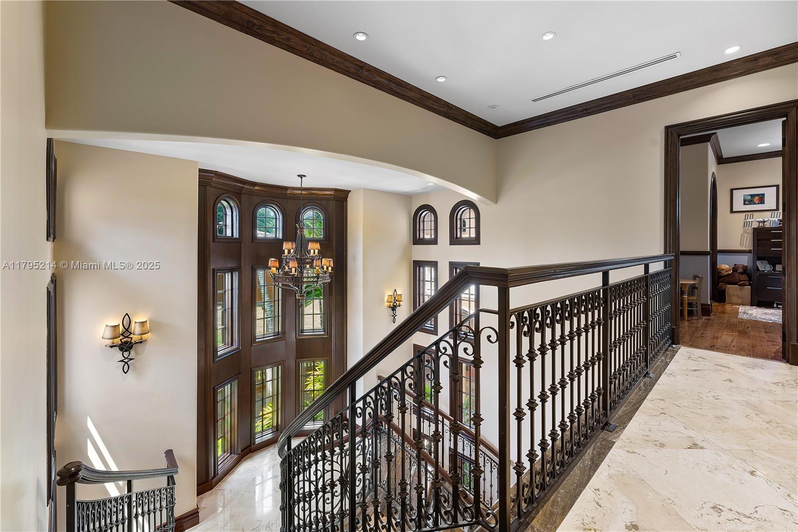17201 Southwest 248th Street Homestead, FL 33031 - Photo 33 of 78 a view of staircase with lots of frames on wall and a potted plant