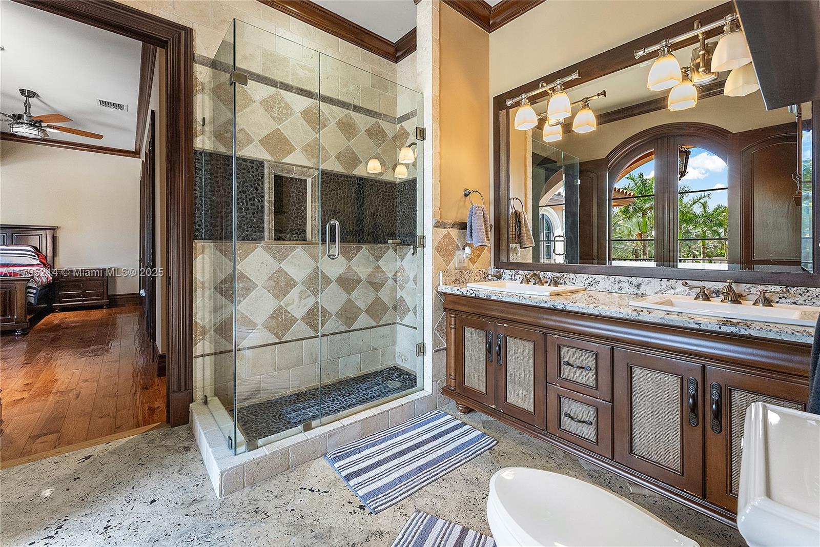 17201 Southwest 248th Street Homestead, FL 33031 - Photo 38 of 78 a bathroom with a sink a mirror and a shower