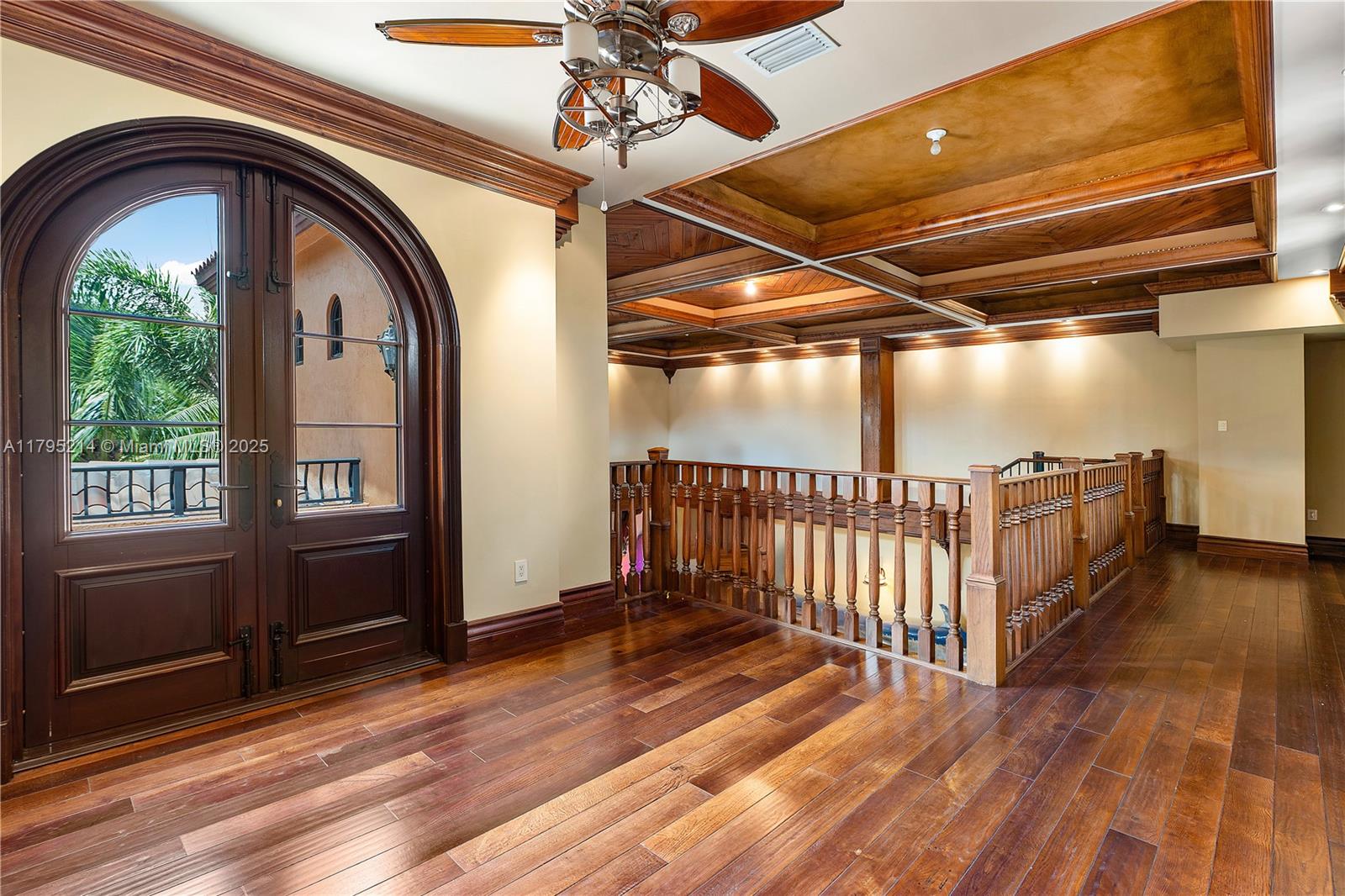 17201 Southwest 248th Street Homestead, FL 33031 - Photo 45 of 78 a view of a porch with wooden floor and iron stairs