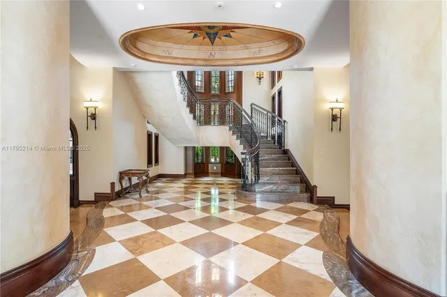 a large kitchen with stainless steel appliances granite countertop a stove and cabinets