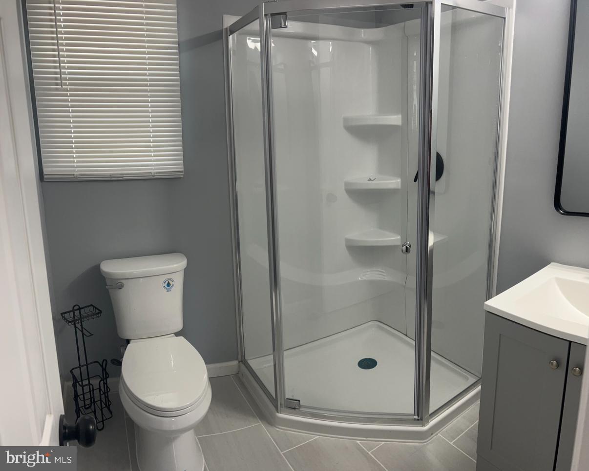 26 Oaktree Drive Levittown, PA 19055 - Photo 15 of 19 a bathroom with a toilet and a shower