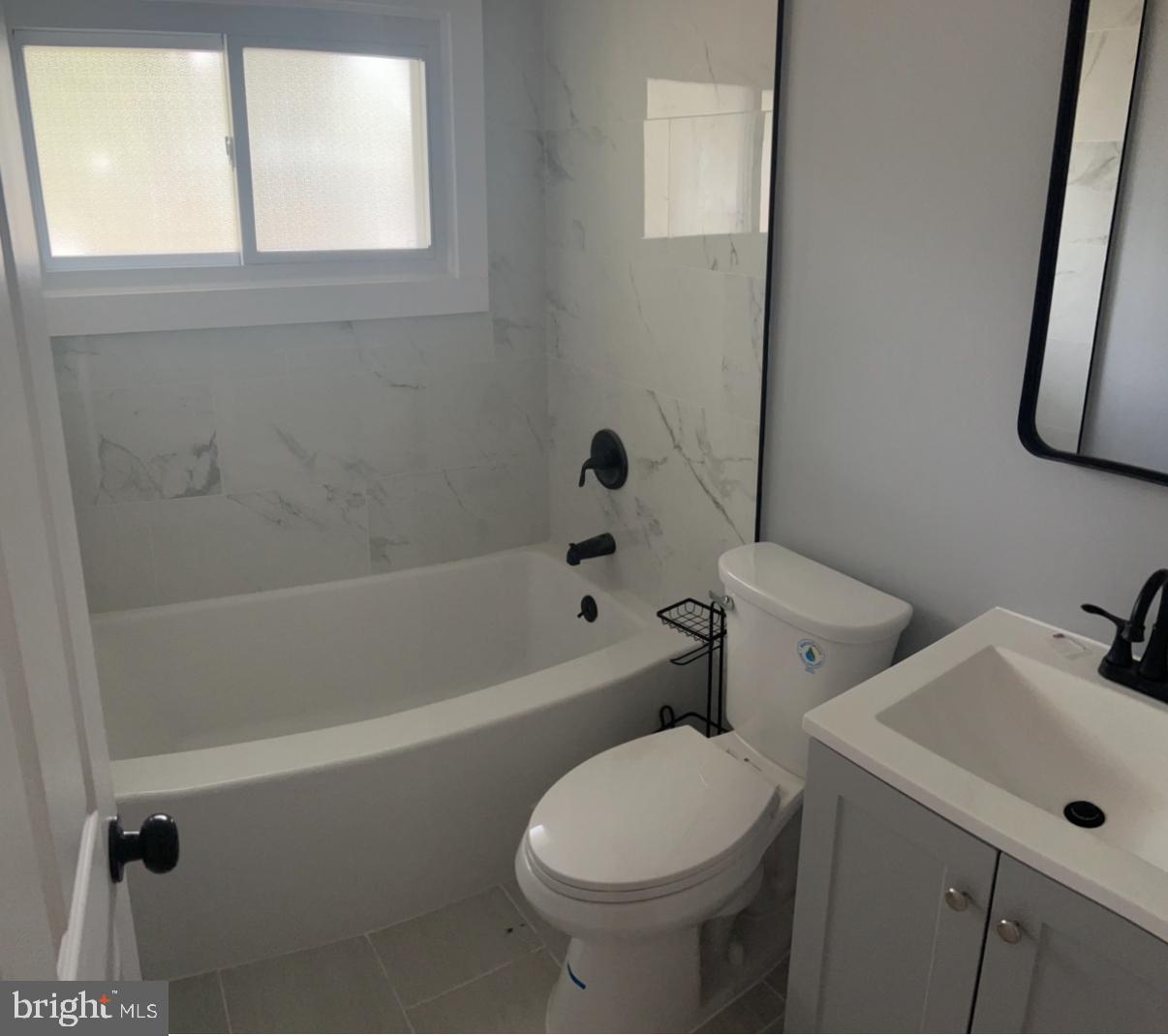 26 Oaktree Drive Levittown, PA 19055 - Photo 16 of 19 a white toilet sitting next to a bath tub