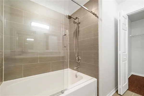 a bathroom with a bathtub and a shower