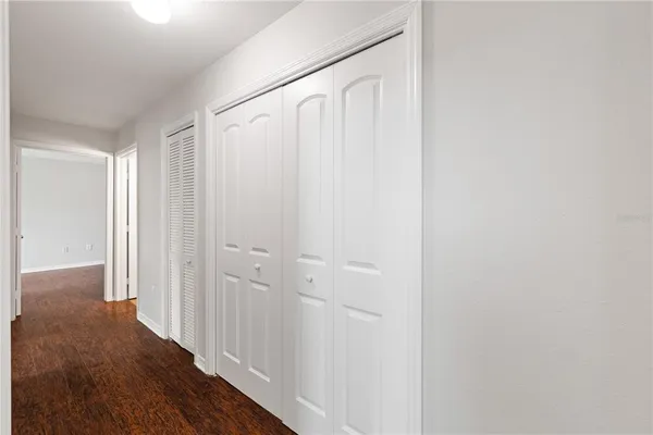 a view of a room with wooden floor