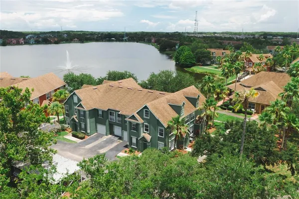 an aerial view of a house with garden space and outdoor seating