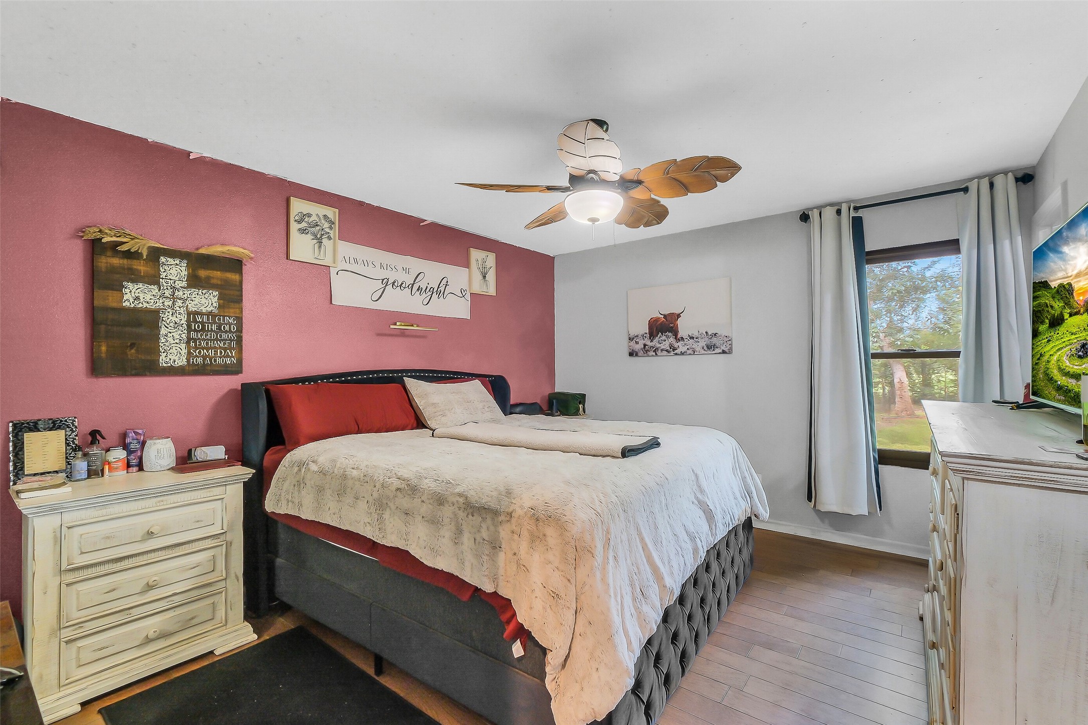 603 Hackamore Road Simonton, TX 77485 - Photo 11 of 21 a bedroom with a bed and a chandelier