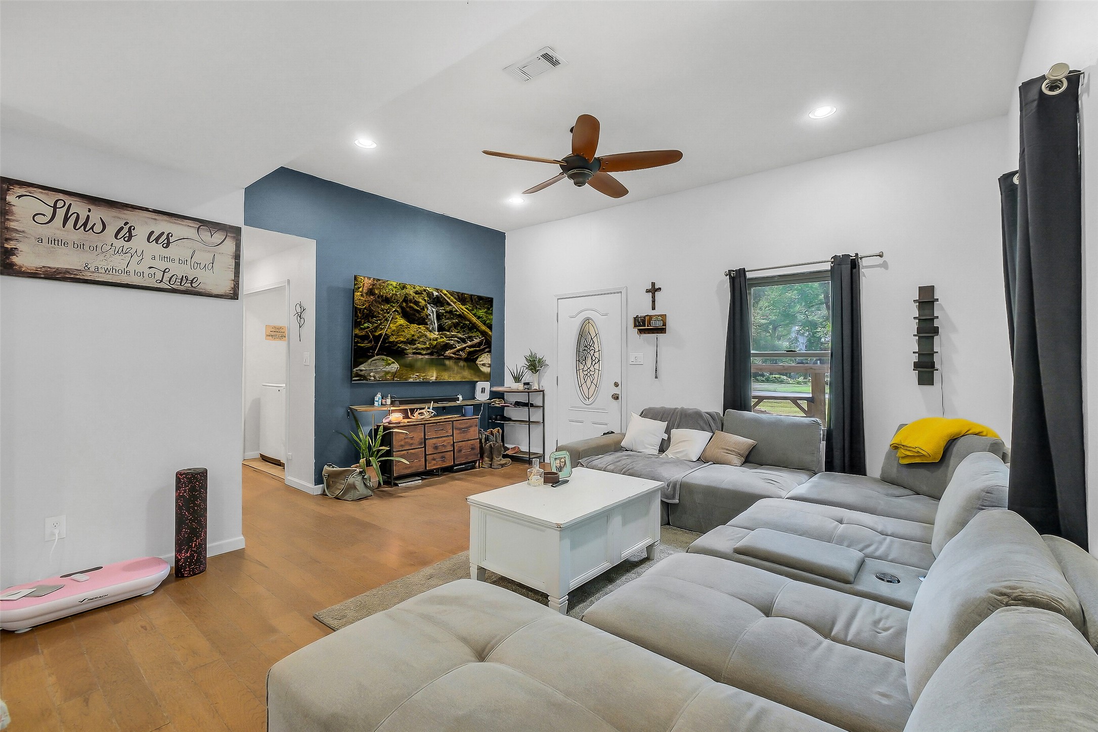 603 Hackamore Road Simonton, TX 77485 - Photo 5 of 21 a living room with furniture and a flat screen tv