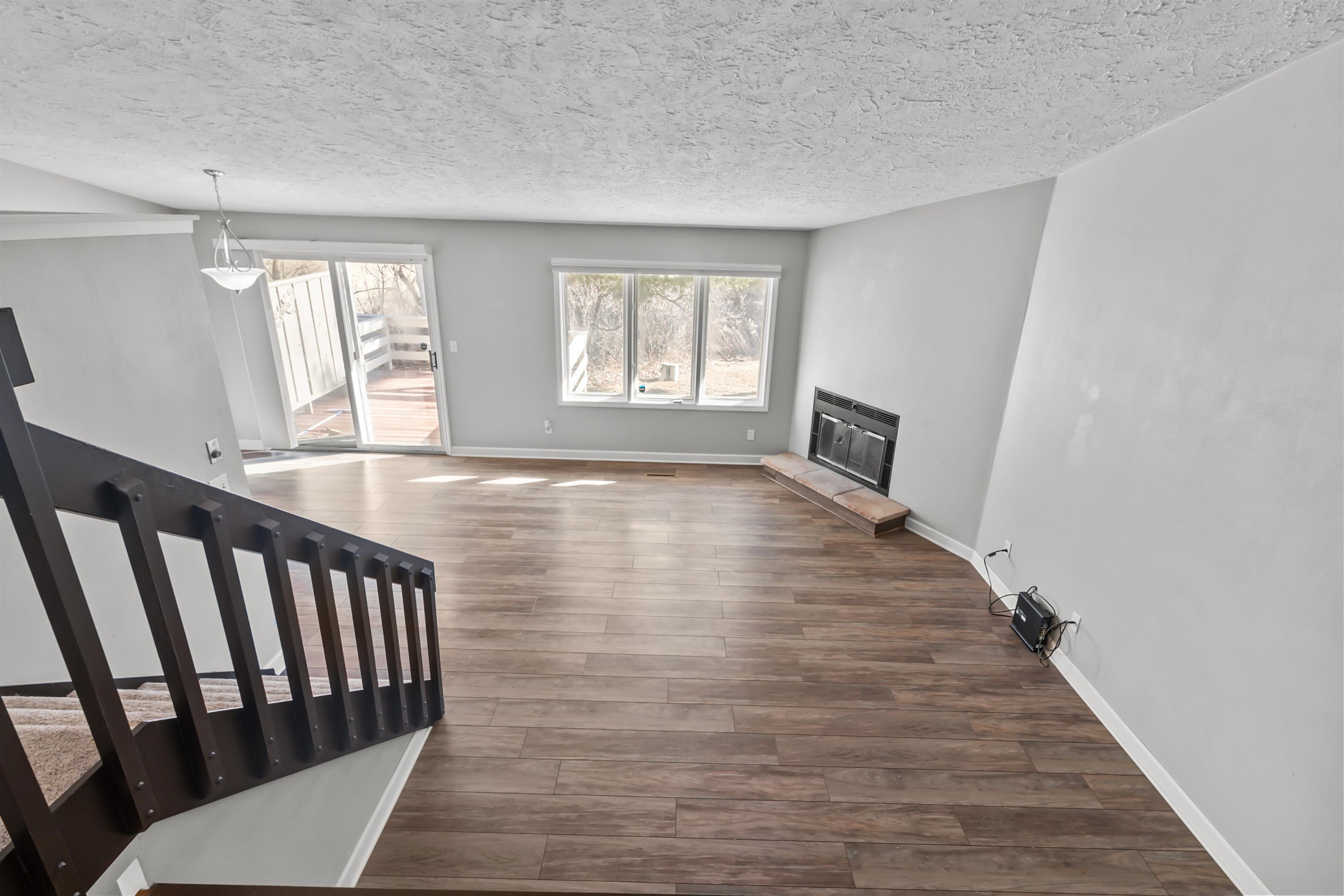 4657 High Point Drive, Unit 32 Rockford, IL 61114 - Photo 14 of 27 a view of an empty room with wooden floor and a window