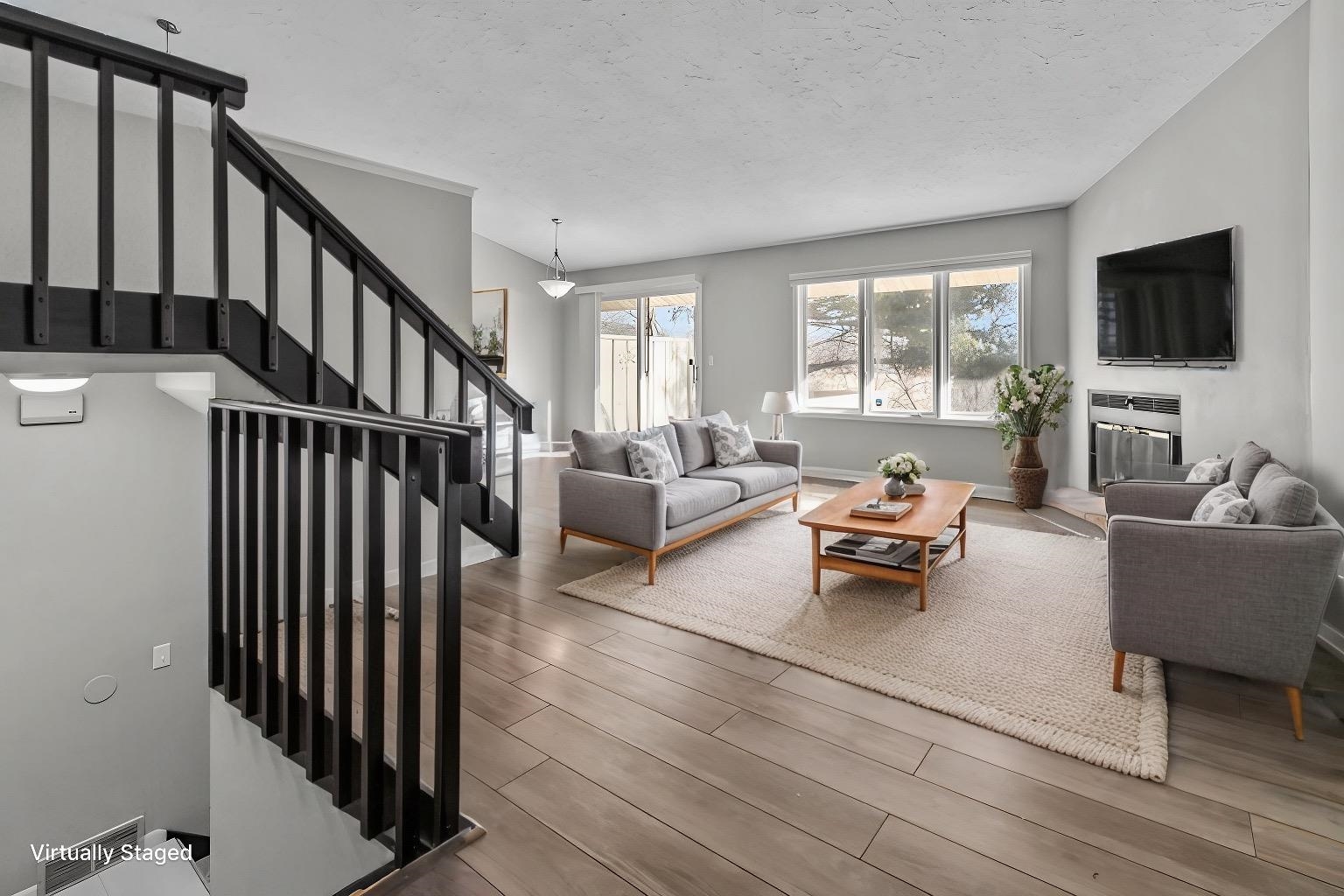4657 High Point Drive, Unit 32 Rockford, IL 61114 - Photo 4 of 27 a living room with furniture fireplace and a flat screen tv