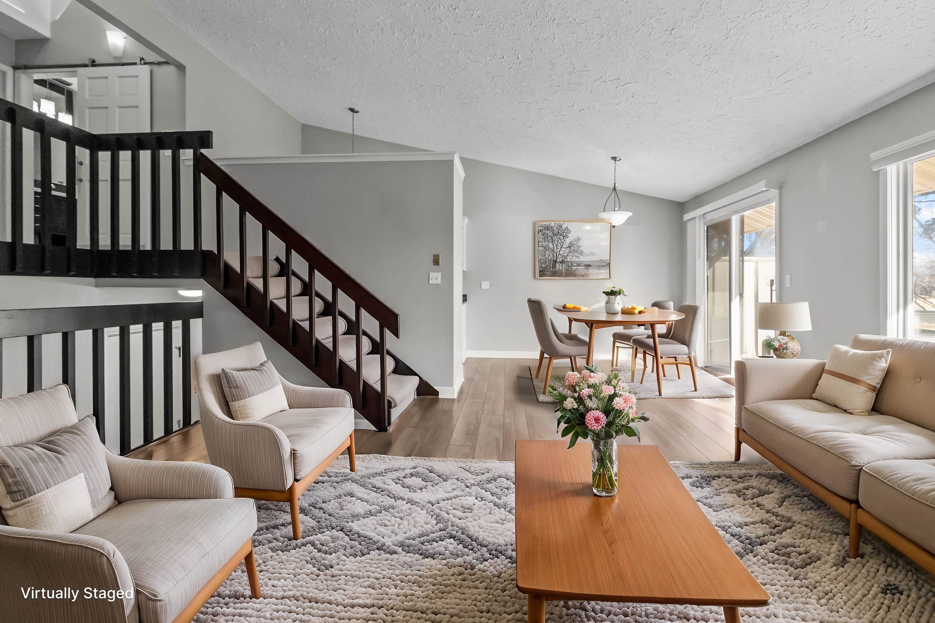 4657 High Point Drive, Unit 32 Rockford, IL 61114 - Photo 5 of 27 a living room with furniture and a dining table