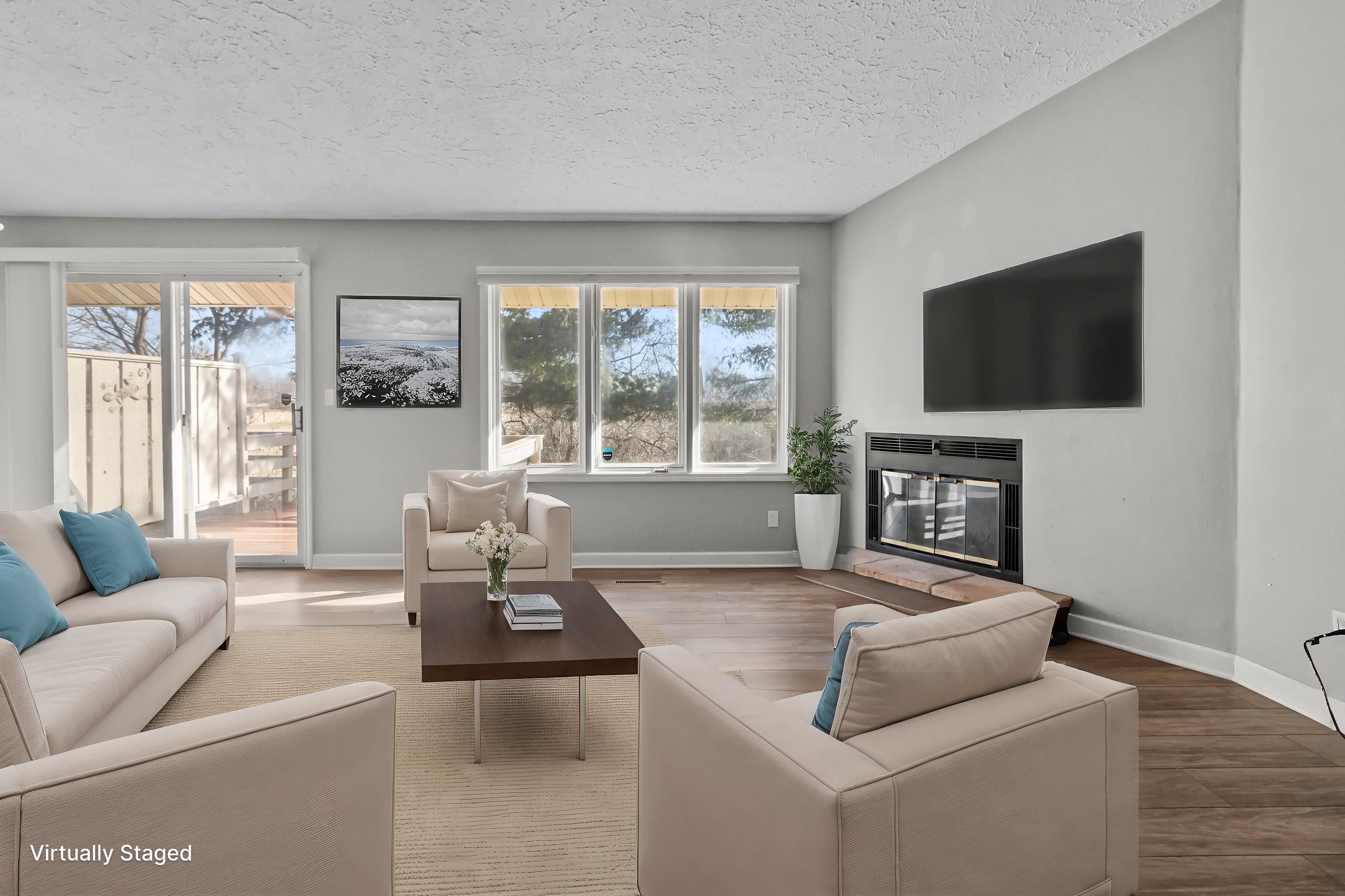 4657 High Point Drive, Unit 32 Rockford, IL 61114 - Photo 6 of 27 a living room with furniture and a flat screen tv