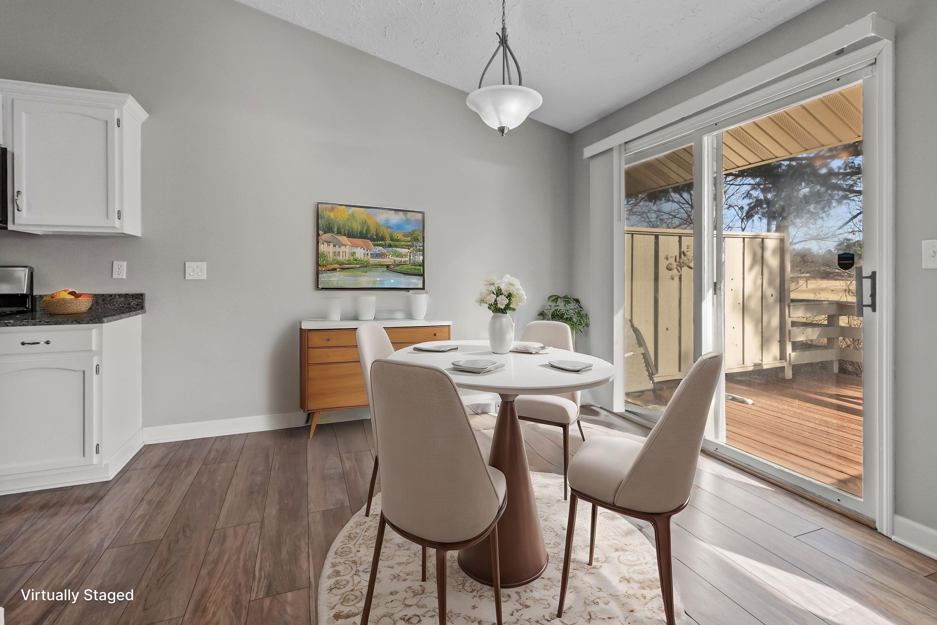 4657 High Point Drive, Unit 32 Rockford, IL 61114 - Photo 8 of 27 a view of a dining room with furniture window and wooden floor