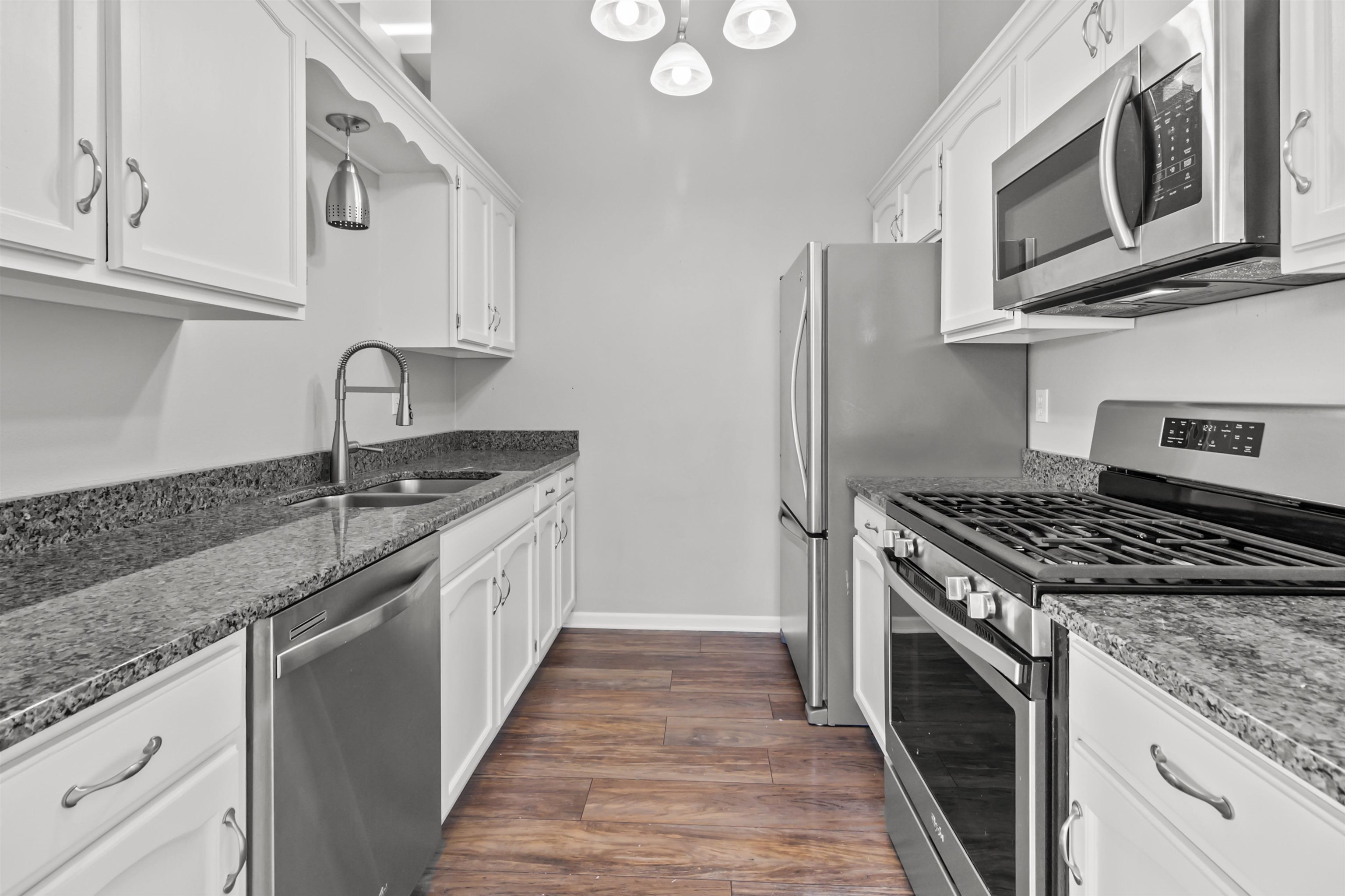 4657 High Point Drive, Unit 32 Rockford, IL 61114 - Photo 9 of 27 a kitchen with stainless steel appliances granite countertop a stove and a sink