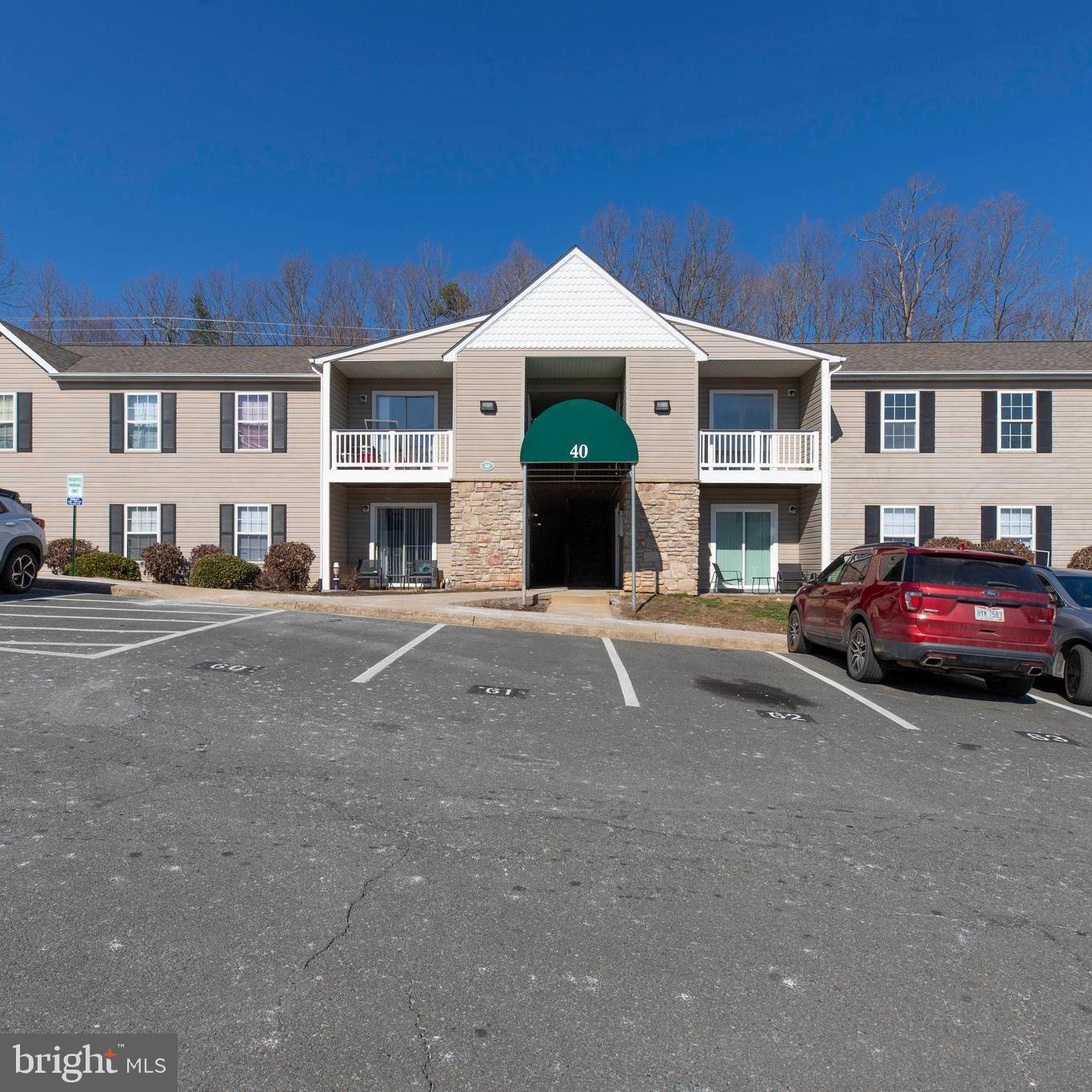 40 Smokewood Court, Unit 40200 Stafford, VA 22554 - Photo 1 of 26 a front view of a house with a yard