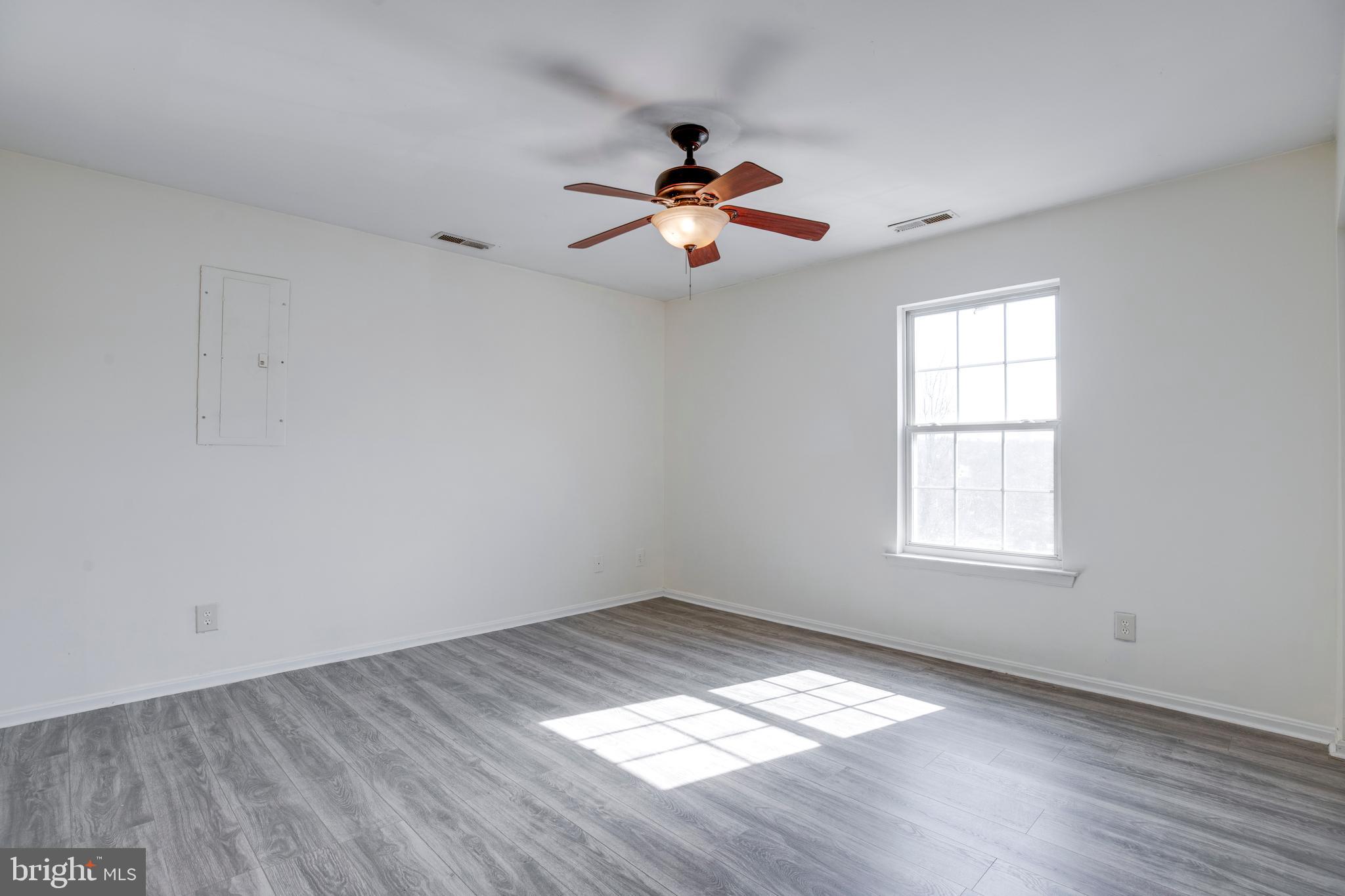 40 Smokewood Court, Unit 40200 Stafford, VA 22554 - Photo 12 of 26 a view of empty room with wooden floor and fan