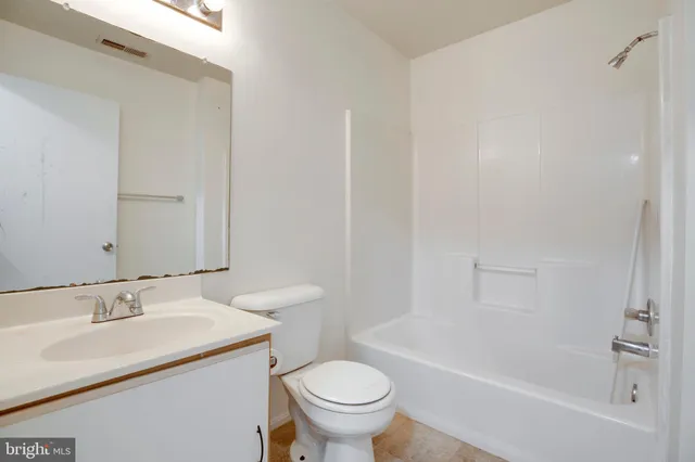 a bathroom with a sink toilet and a bathtub