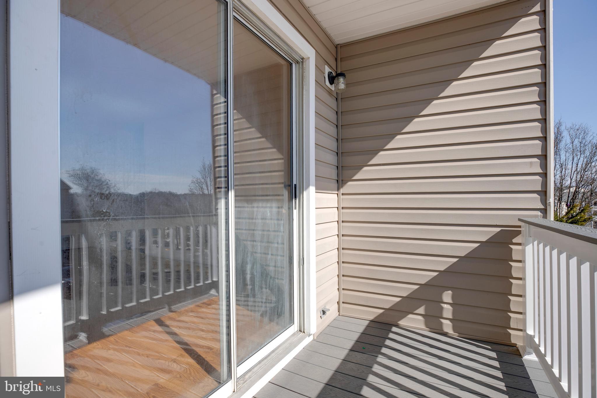40 Smokewood Court, Unit 40200 Stafford, VA 22554 - Photo 24 of 26 a view of a balcony with wooden floor