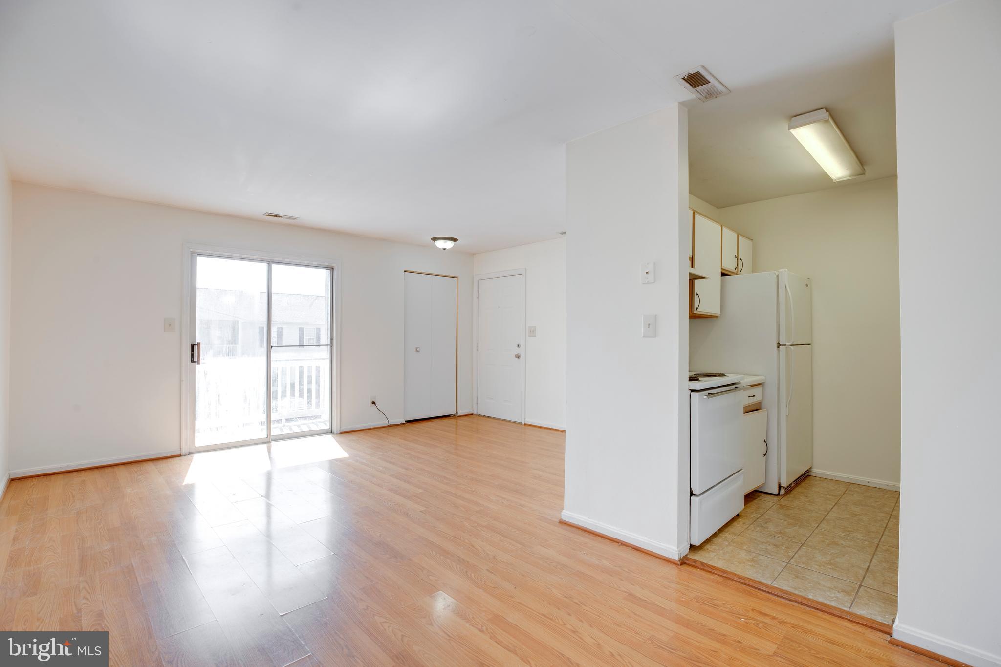 40 Smokewood Court, Unit 40200 Stafford, VA 22554 - Photo 6 of 26 a view of a kitchen with wooden floor and electronic appliances