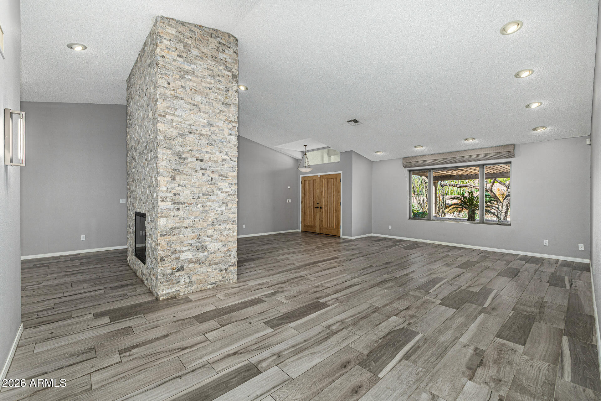 801 East Acoma Drive Phoenix, AZ 85022 - Photo 11 of 62 wooden floor in an empty room with a window
