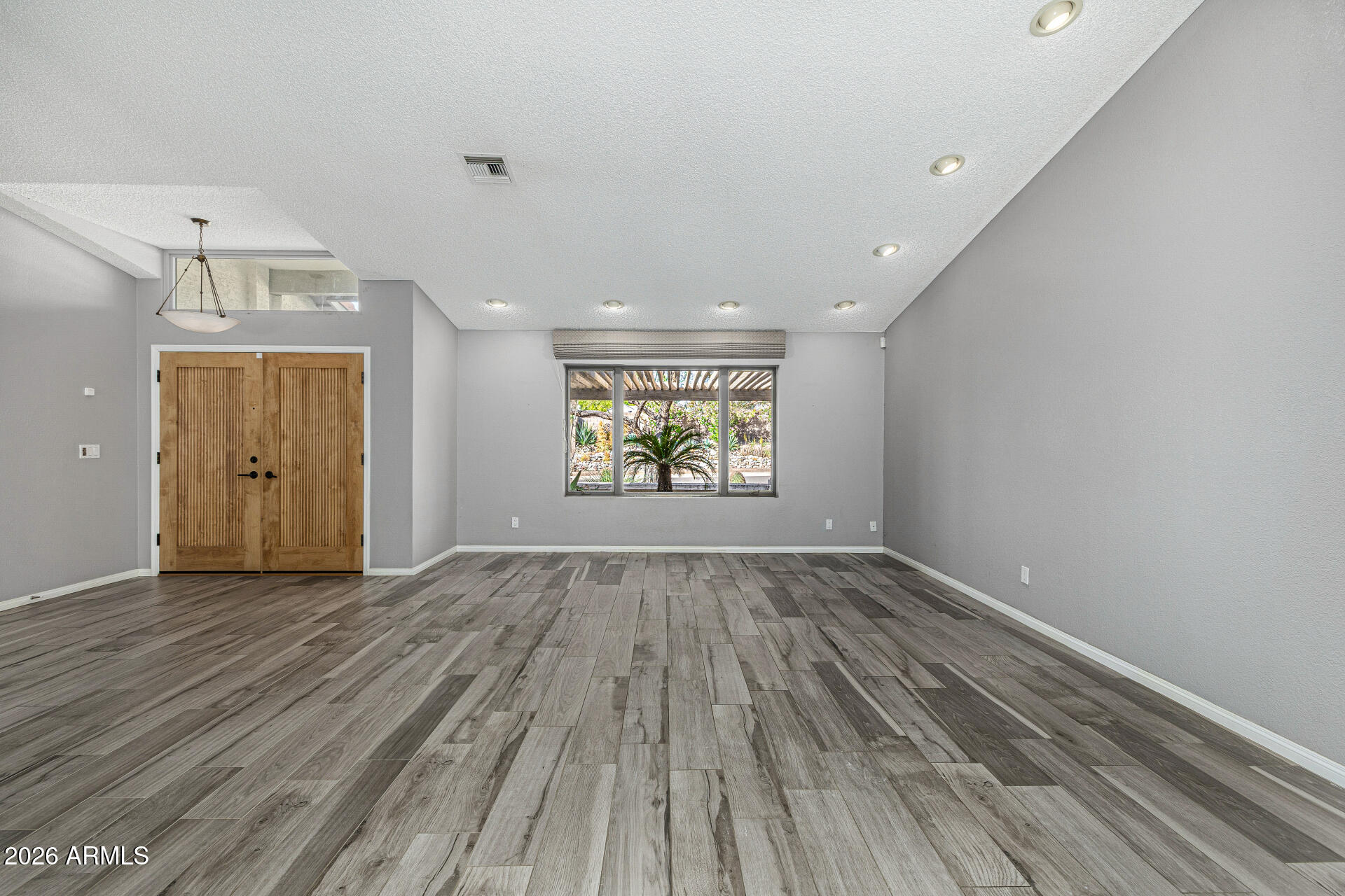801 East Acoma Drive Phoenix, AZ 85022 - Photo 13 of 62 wooden floor in an empty room with a window