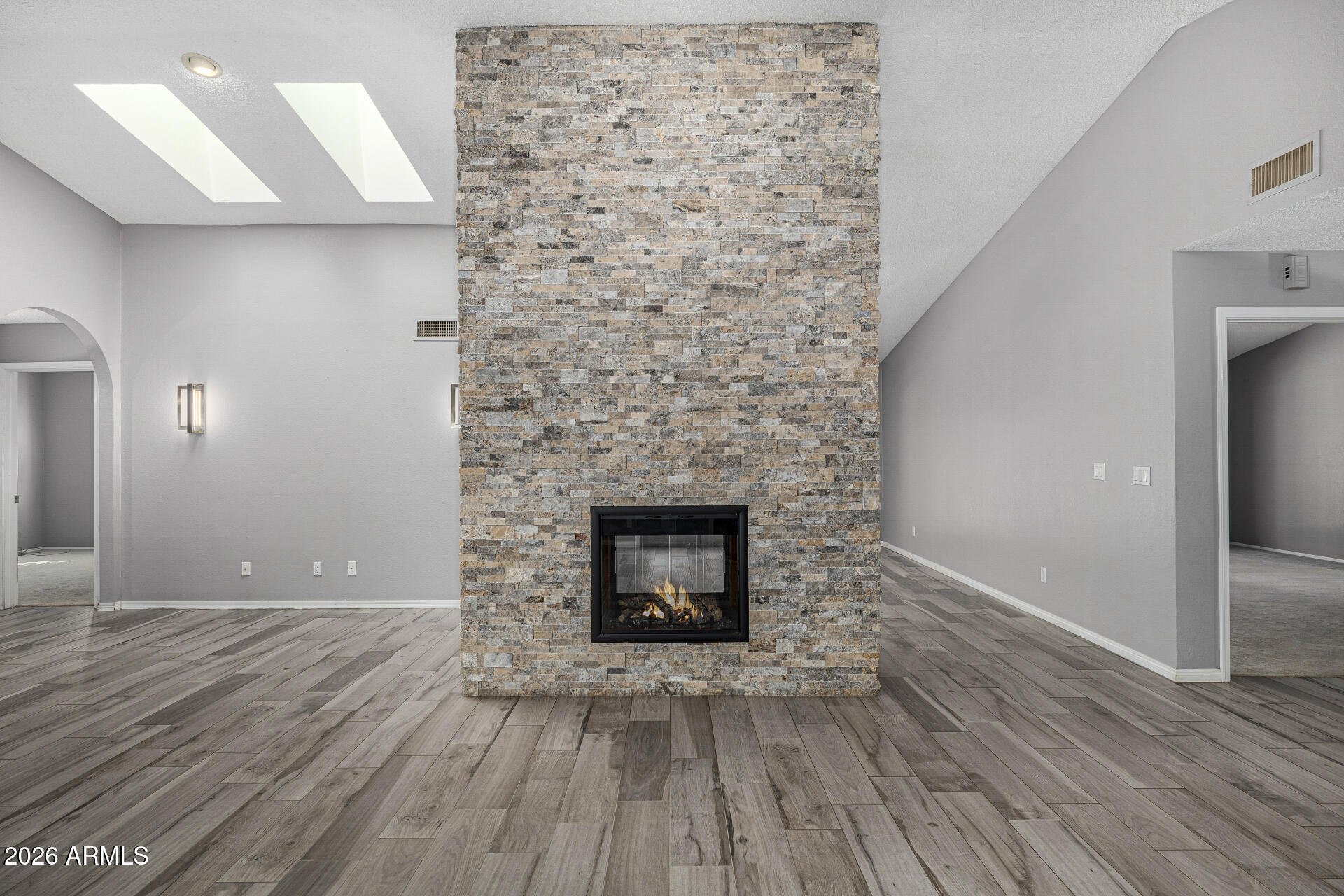 801 East Acoma Drive Phoenix, AZ 85022 - Photo 15 of 62 a view of empty room with wooden floor and fireplace