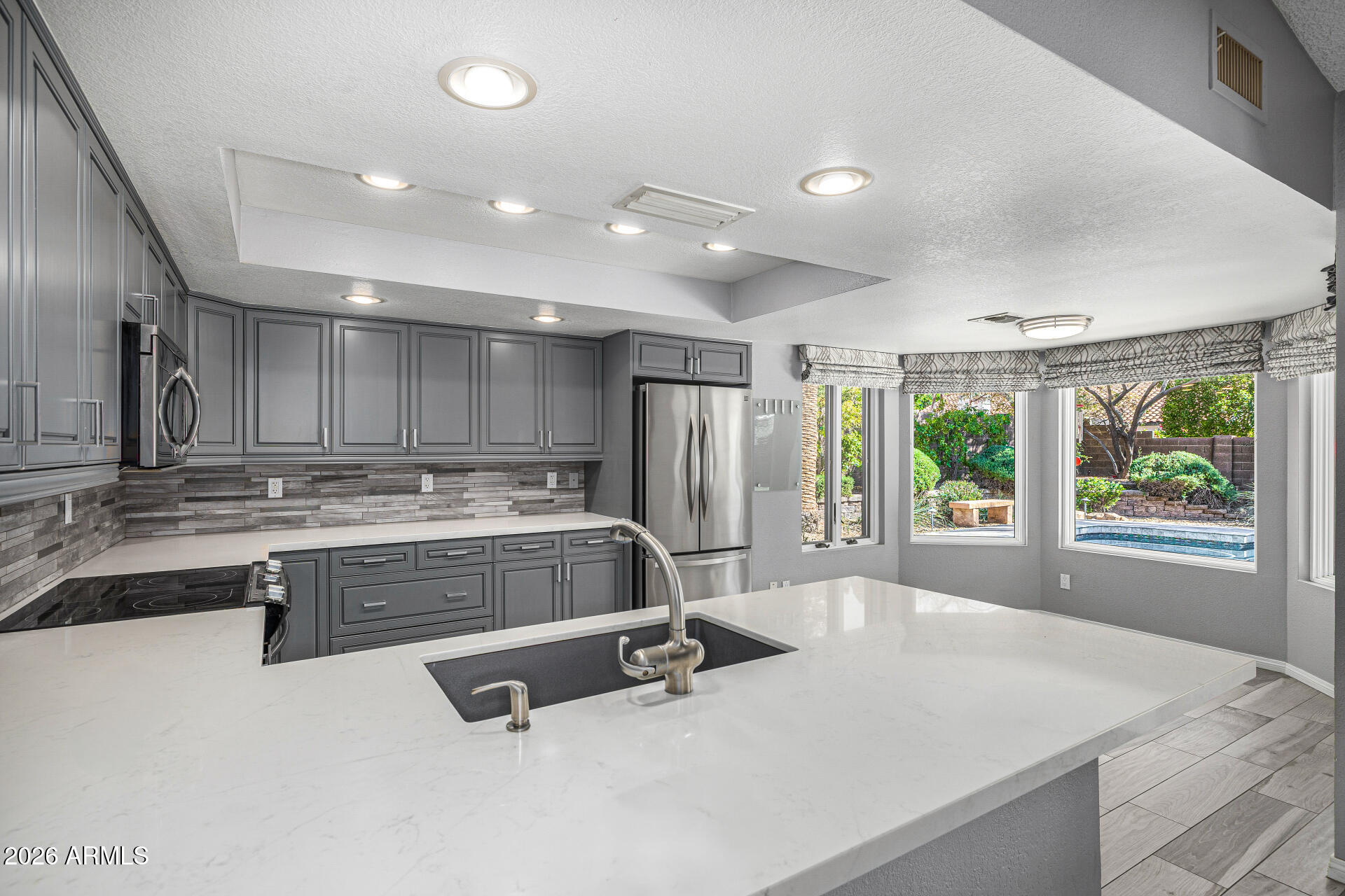 801 East Acoma Drive Phoenix, AZ 85022 - Photo 22 of 62 a view of kitchen with stainless steel appliances granite countertop sink and stove
