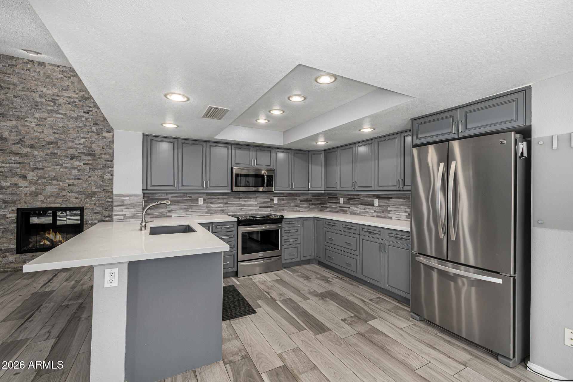 801 East Acoma Drive Phoenix, AZ 85022 - Photo 25 of 62 a kitchen with a sink stainless steel appliances and counter space